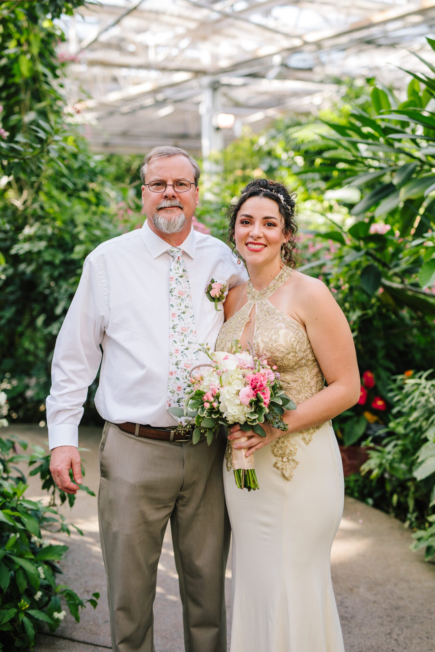 The bride and her father before walking down the aisle for her Butterfly Pavilion wedding.