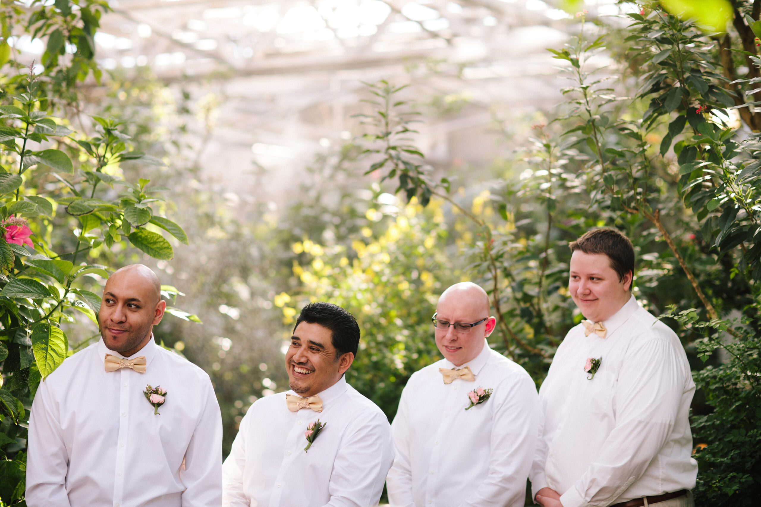 The groommen laughing during the Butterfly Pavilion wedding ceremony. 