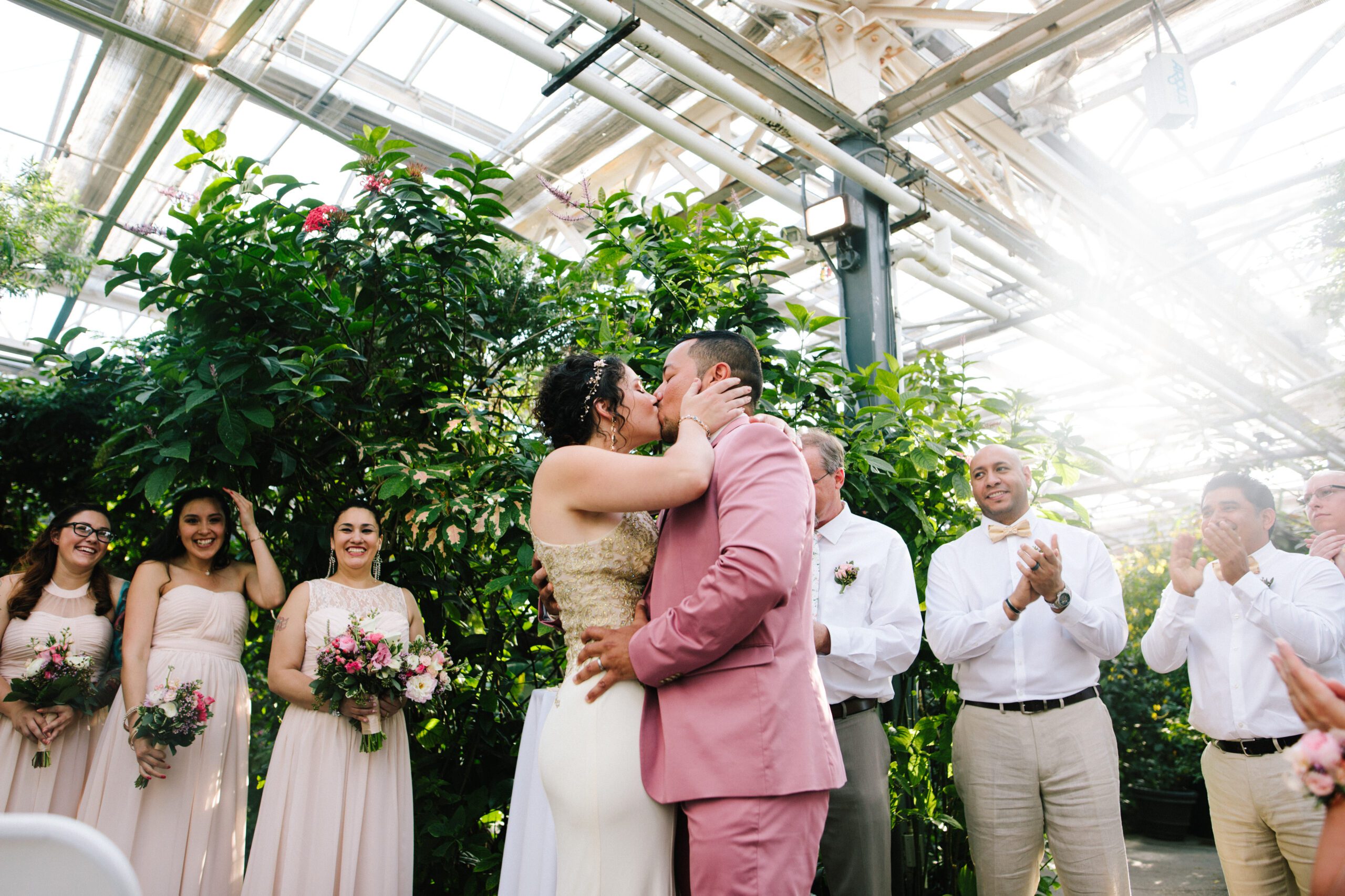 The bride and groom kiss for the first time during their Butterfly Pavilion Wedding. ⁠