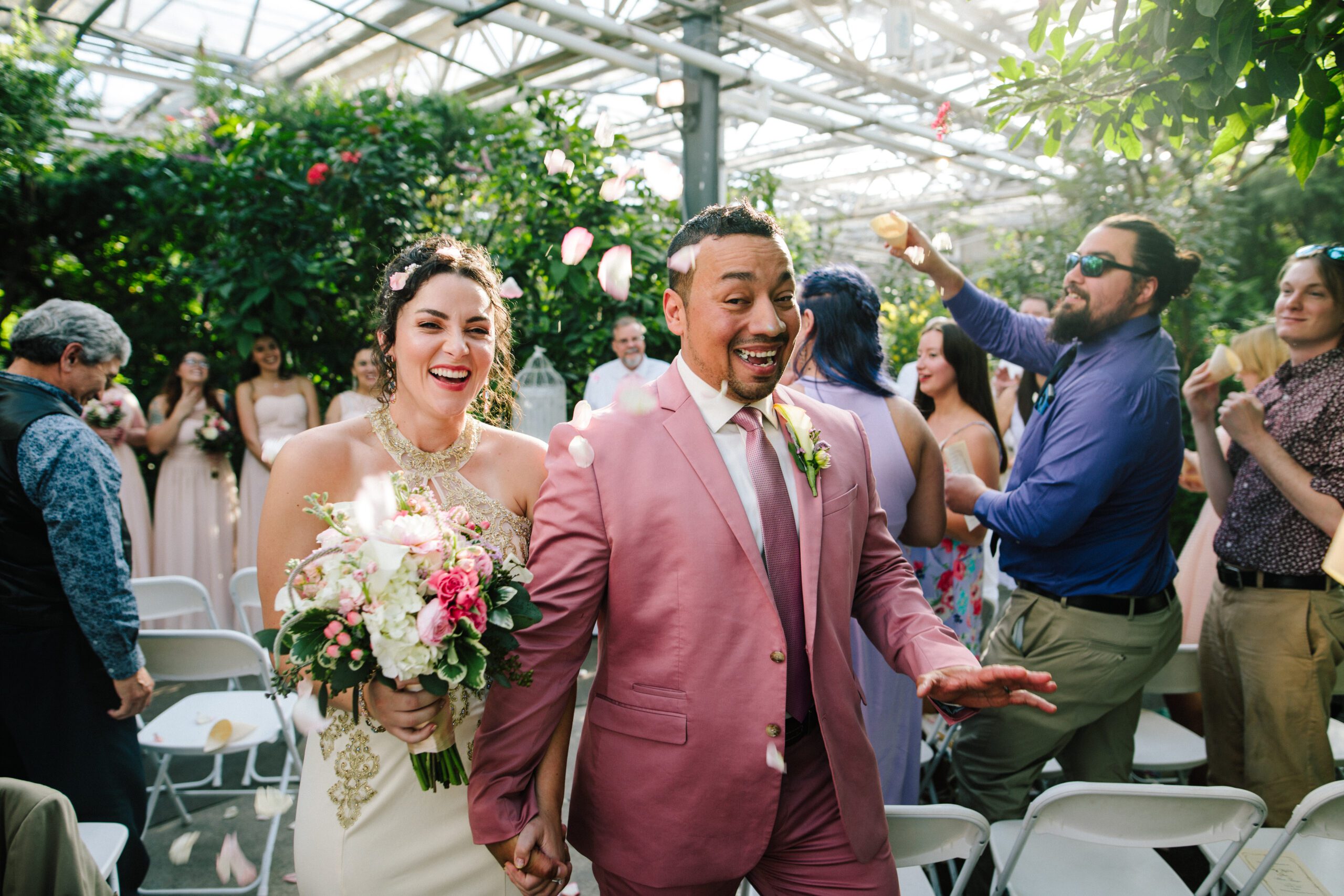 The bride and groom walk down the aisle after their intimate ceremony from their Butterfly Pavilion Wedding. ⁠