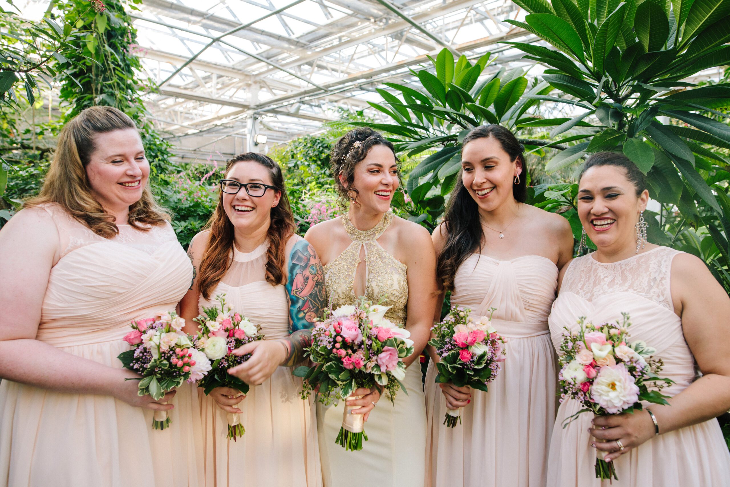 The bride wither ladies in pink dresses at her Butterfly Pavilion Wedding. ⁠