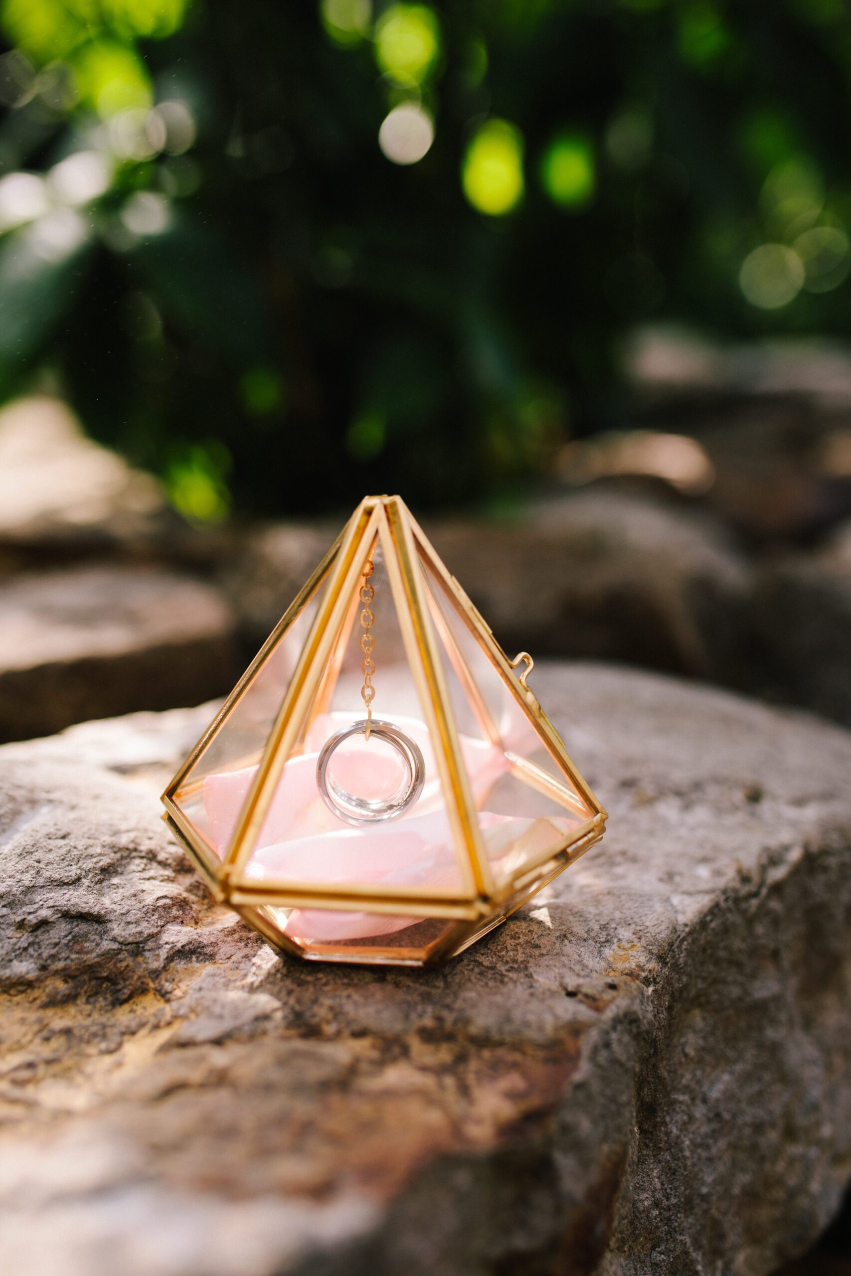 A gorgeous gold diamond ring holder at the Butterfly Pavilion wedding.