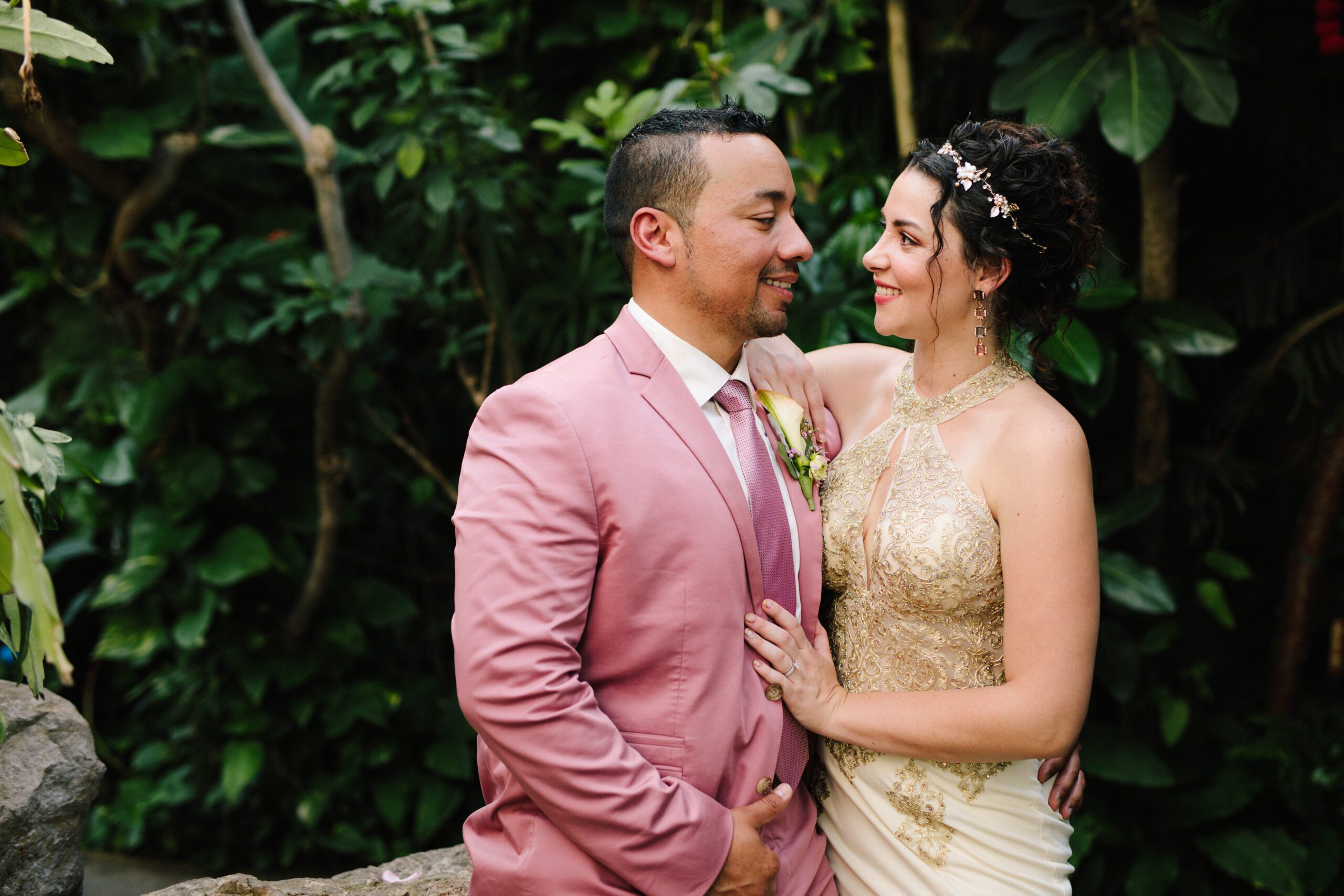 A sweet shot of the bride and groom looking at each other inside the Butterfly Pavilion oasis on their Wedding day. ⁠