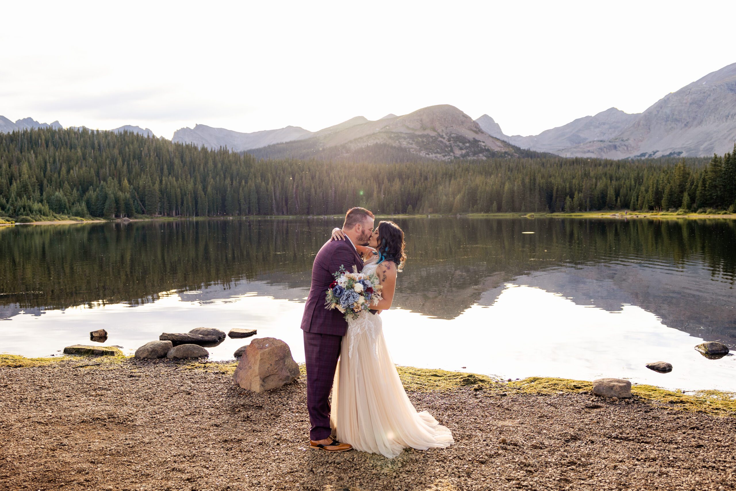 Their first kiss as husband and wife after their Brainard Lake Elopement.