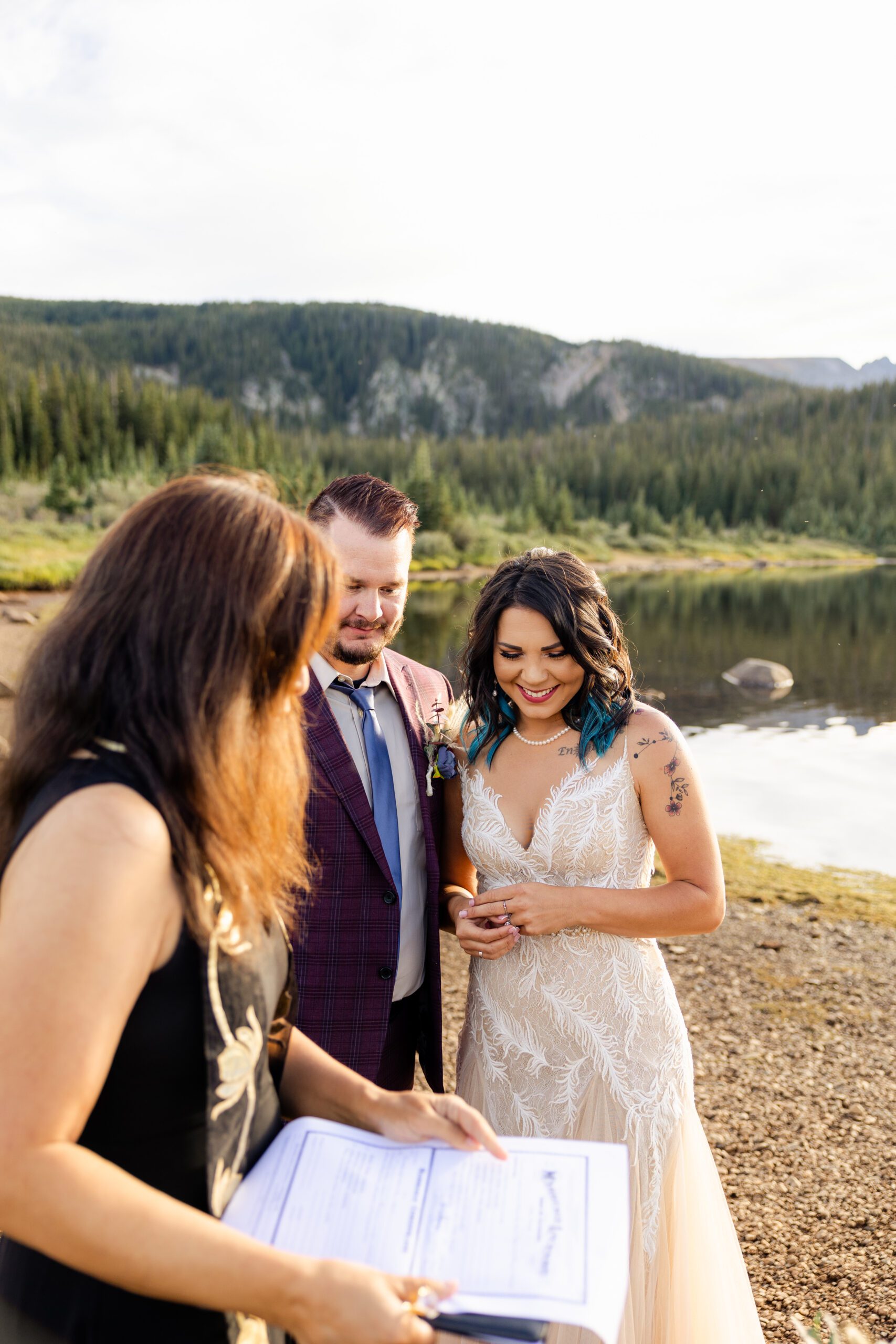The bride and groom signing their marriage license after their Brainard Lake Elopement. 
