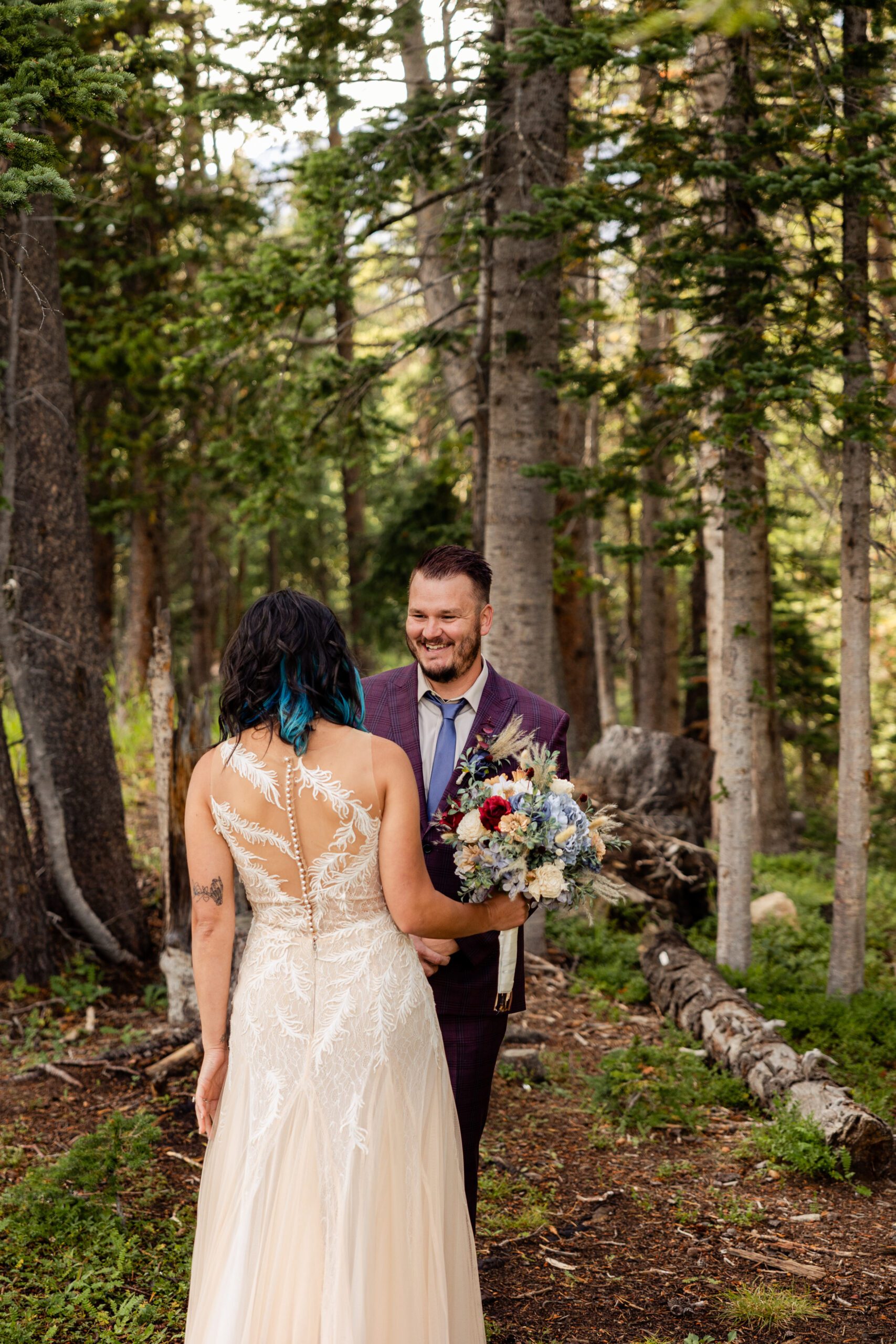 Groom turns to see his bride for his first look before their Brainard Lake Elopement ceremony. 