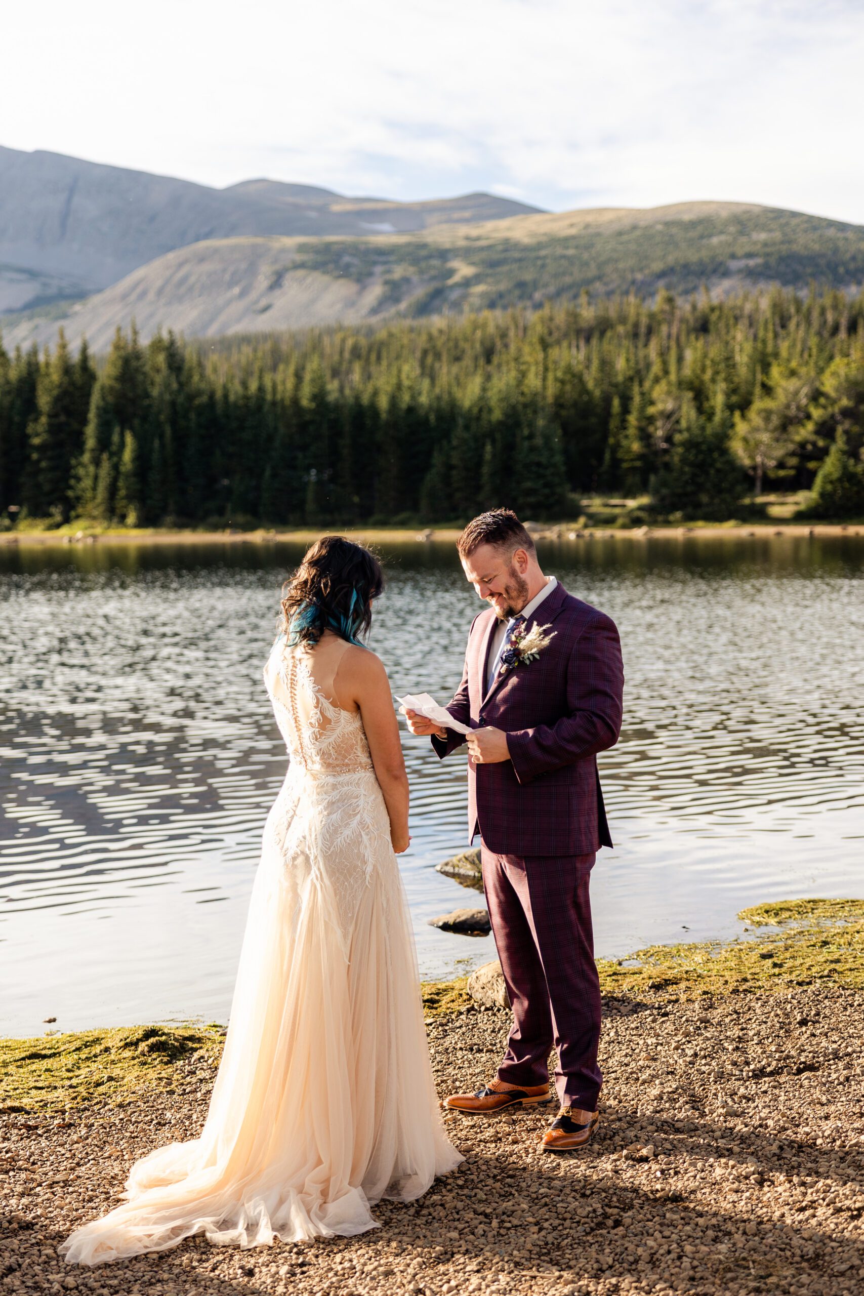 Groom reading his vows to his bride during their Brainard Lake Elopement.