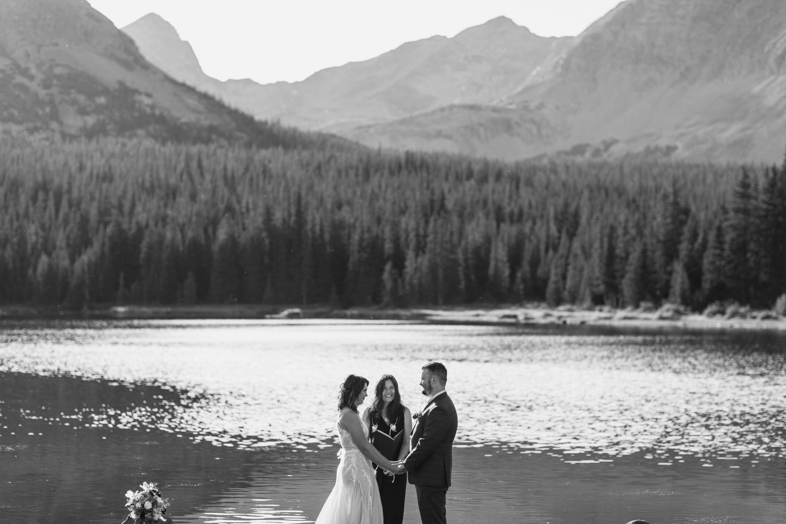 a black and white photo of their intimate ceremony at their Brainard Lake Elopement.