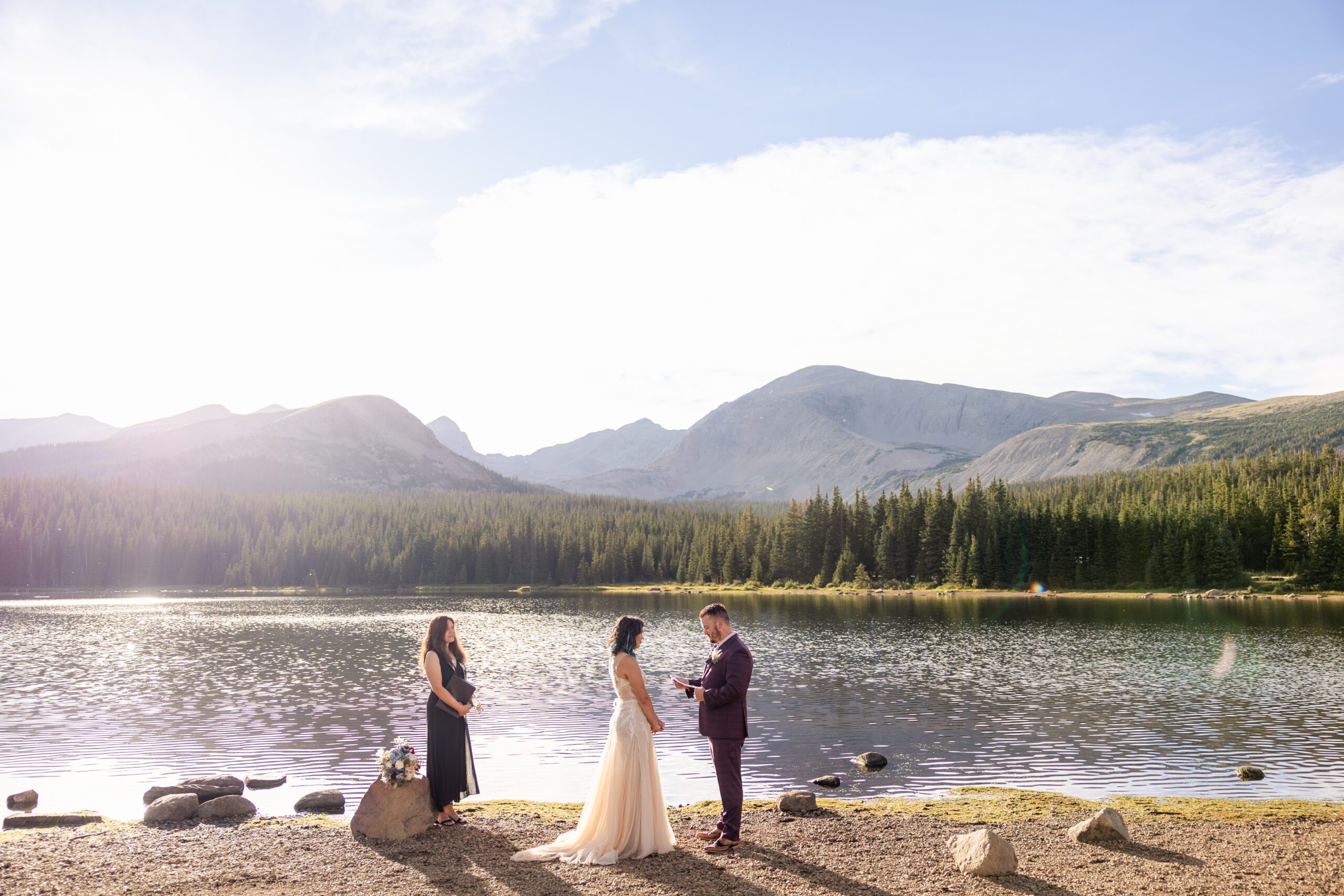 A far away shot of the groom starting to share his vows during their Brainard Lake Elopement.