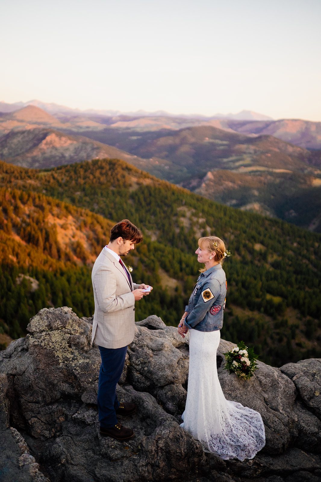 groom reading vows during sunrise elopement ceremony at Lost Gulch Overlook