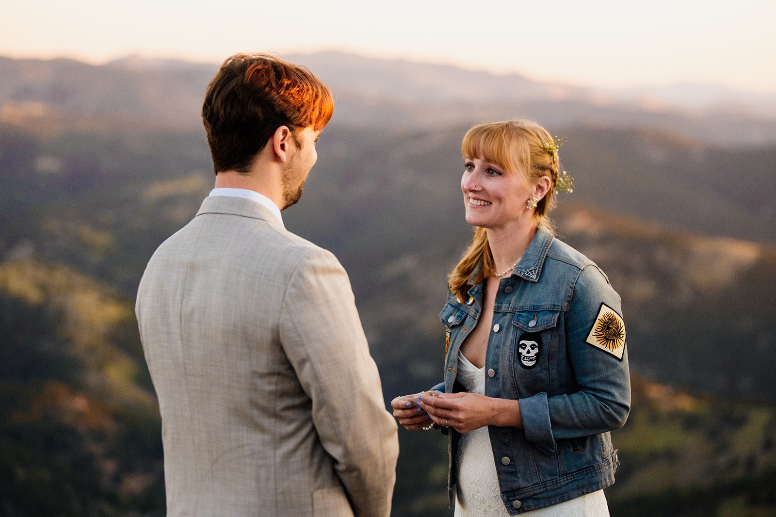 bride reads vows during sunrise elopement at Lost Gulch Overlook.