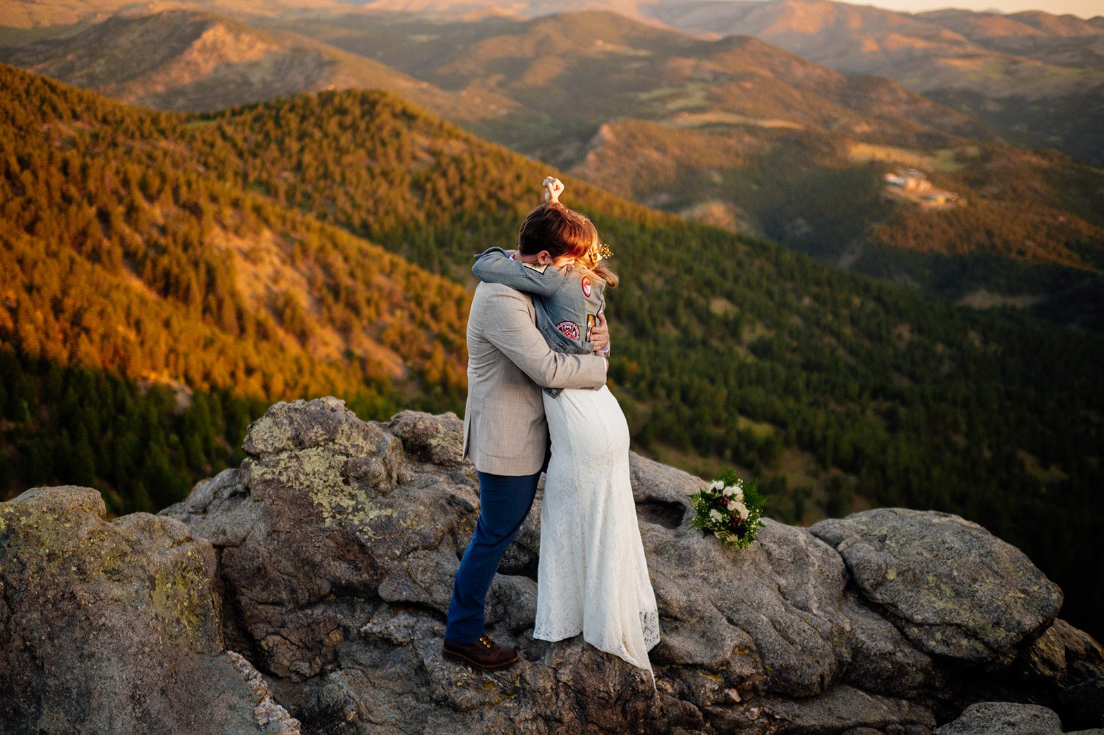 bride and groom hug after becoming official after their sunrise elopement ceremony at Lost Gulch Overlook.
