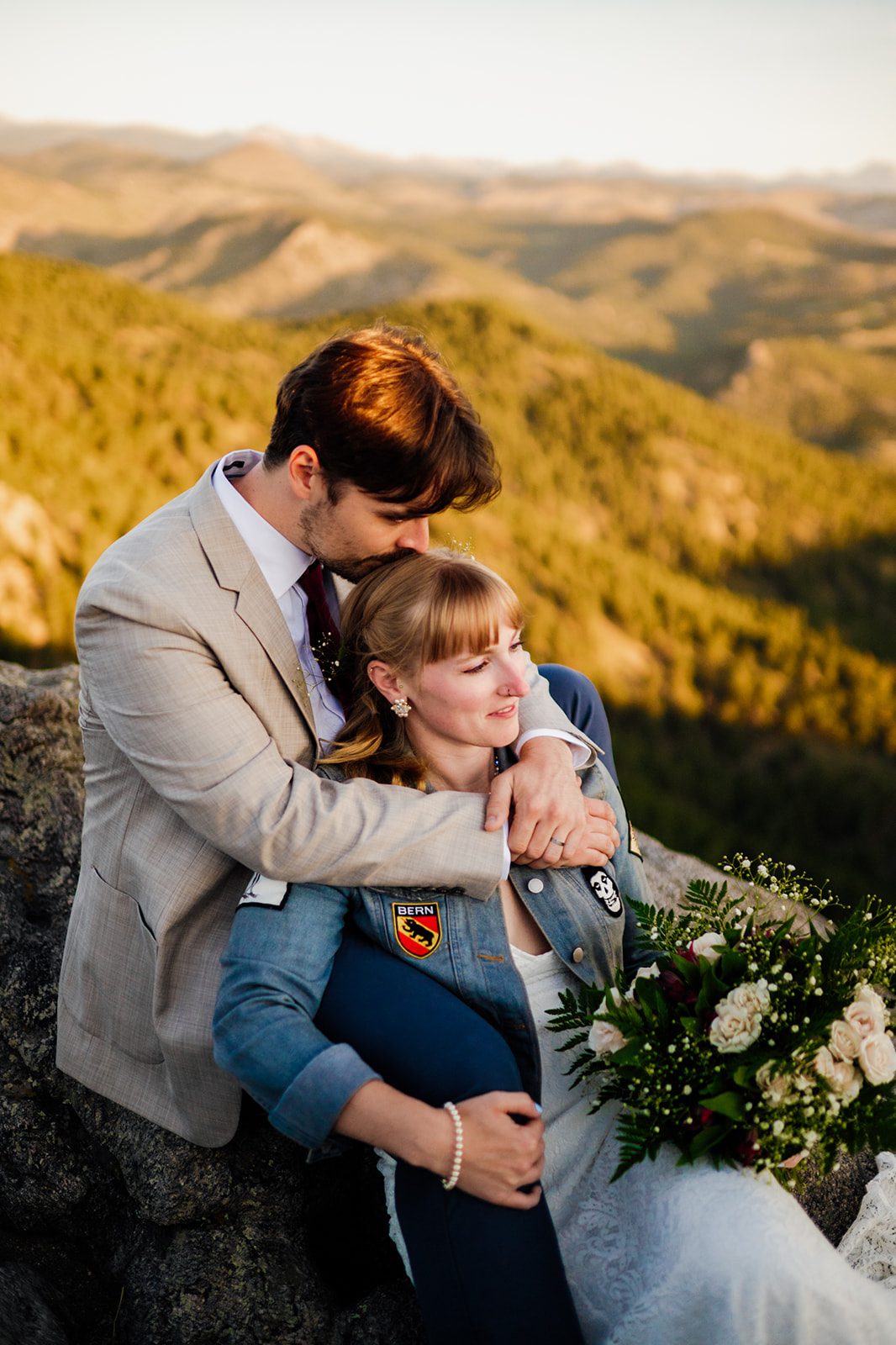 bride and groom soaking up the sunrise on their elopement day at Lost Gulch Overlook