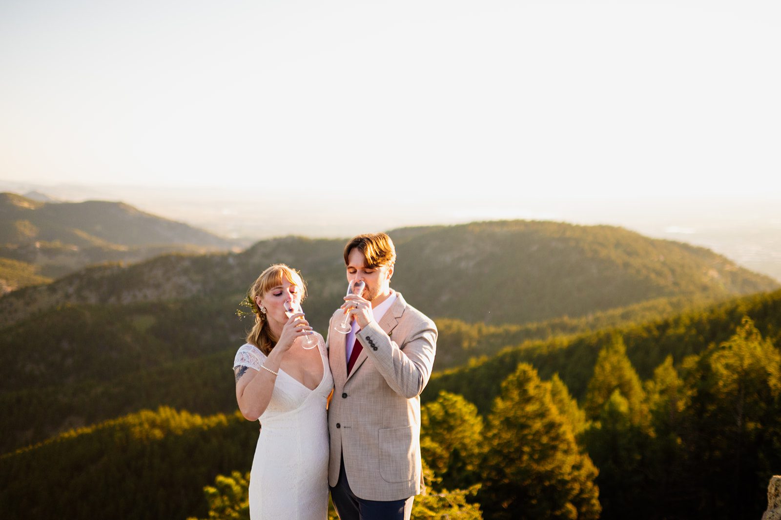 bride and groom drinking champagne after their Lost Gulch Overlook elopement. 