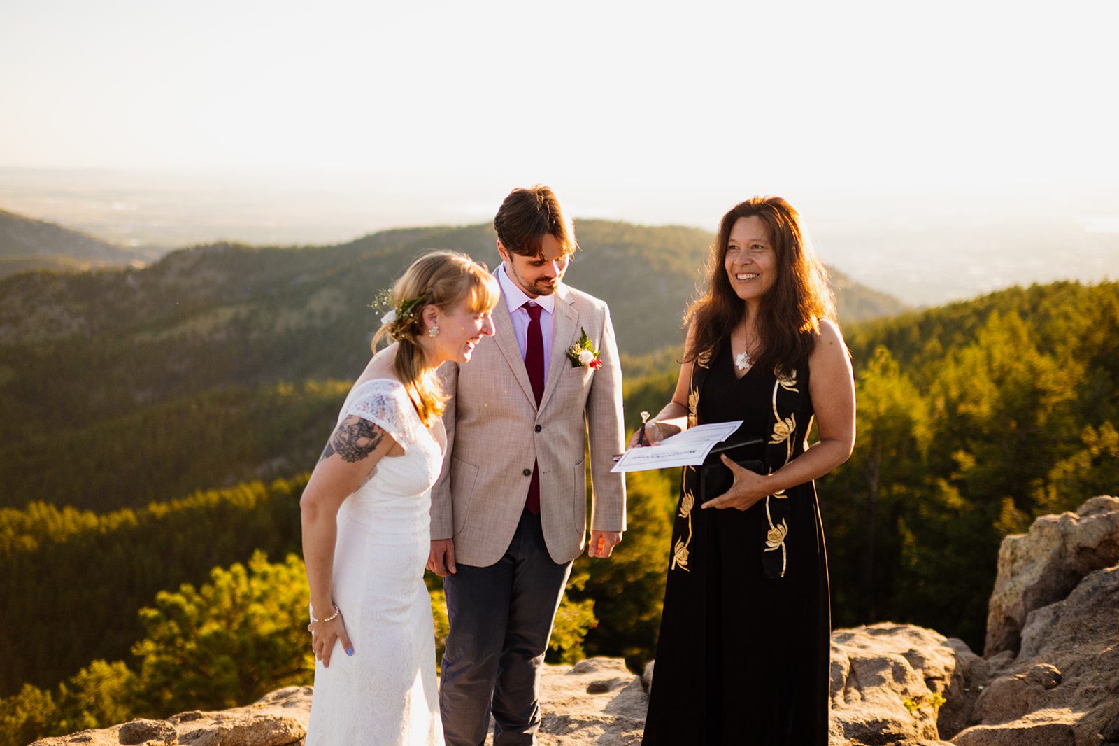 officiant and bride and groom, signing marriage license after Lost Gulch Overlook elopement. 