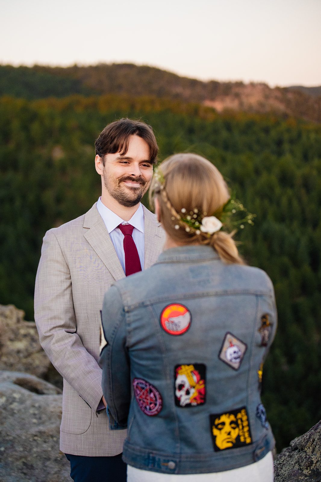 groom smiling at his bride during Lost Gulch Overlook elopement at sunrise.