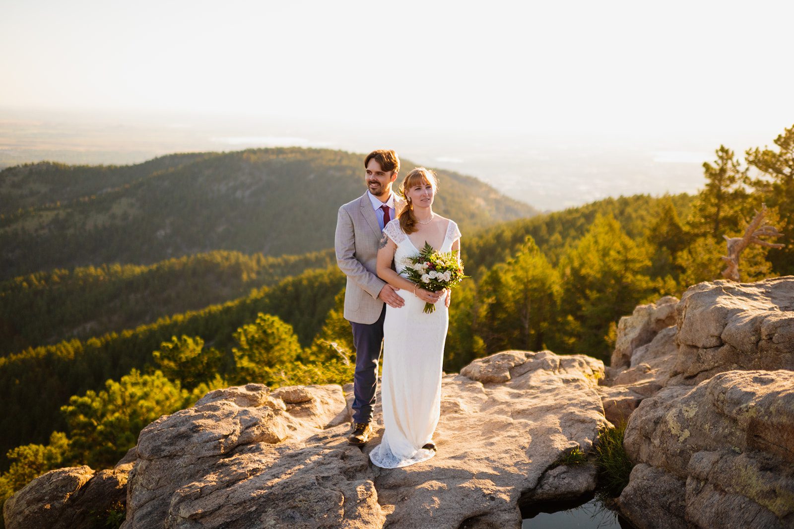 bride and groom atop flagstaff mountain at Lost Gulch Overlook elopement 