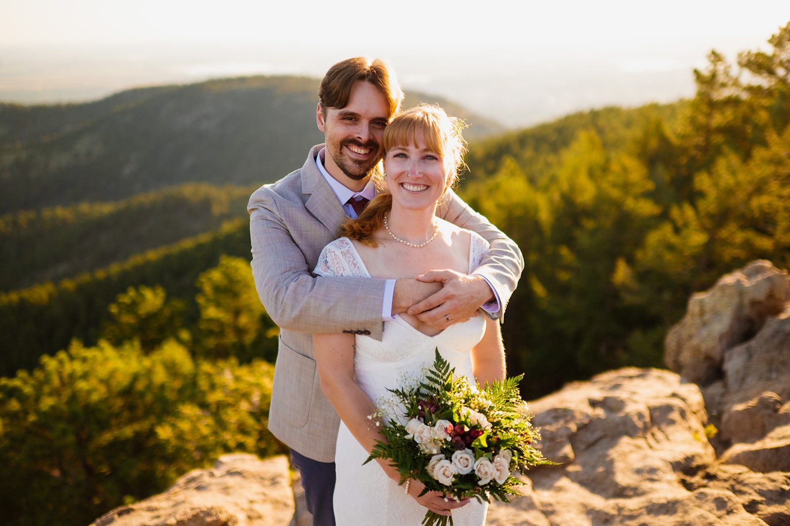newlyweds at Lost Gulch Overlook after elopement ceremony at sunrise 