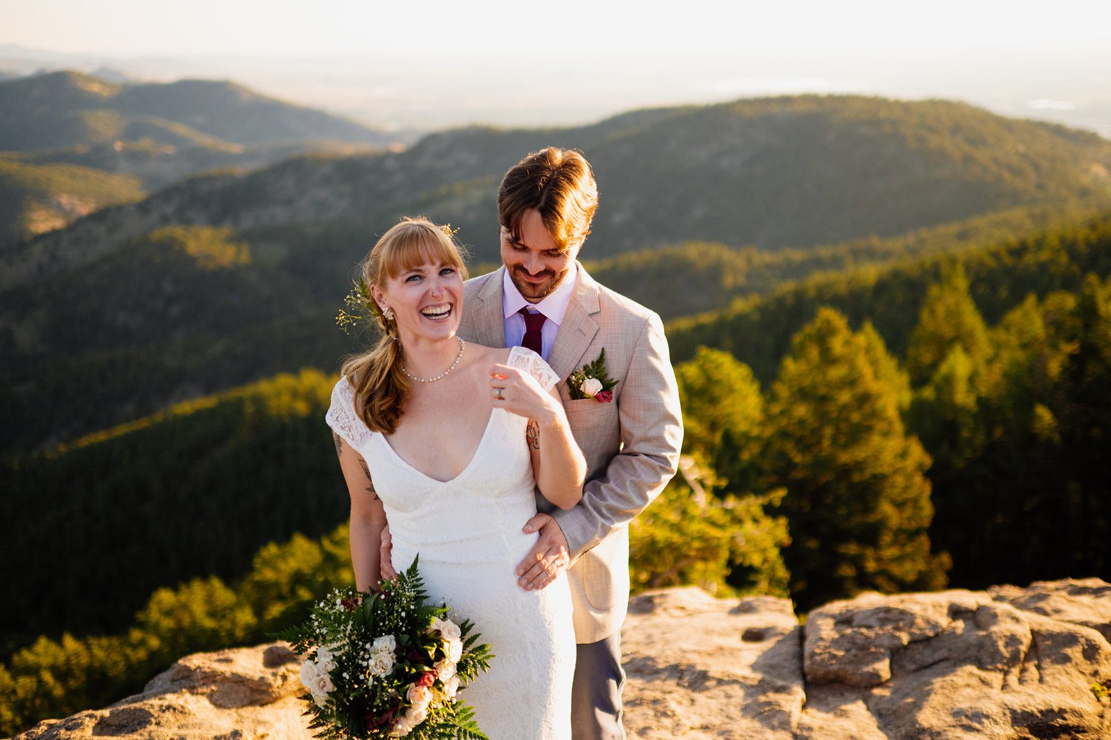 newleyweds smiling during their Lost Gulch Overlook elopement bridal portraits
