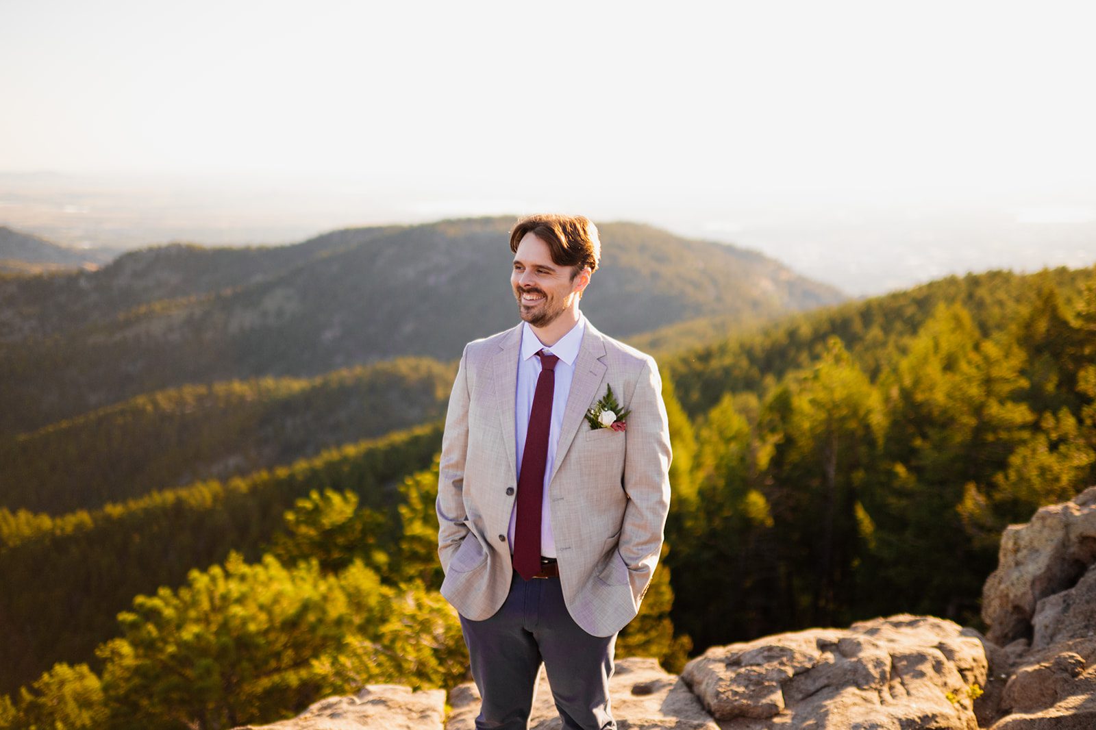groom at Lost Gulch Overlook during sunrise elopement ceremony 