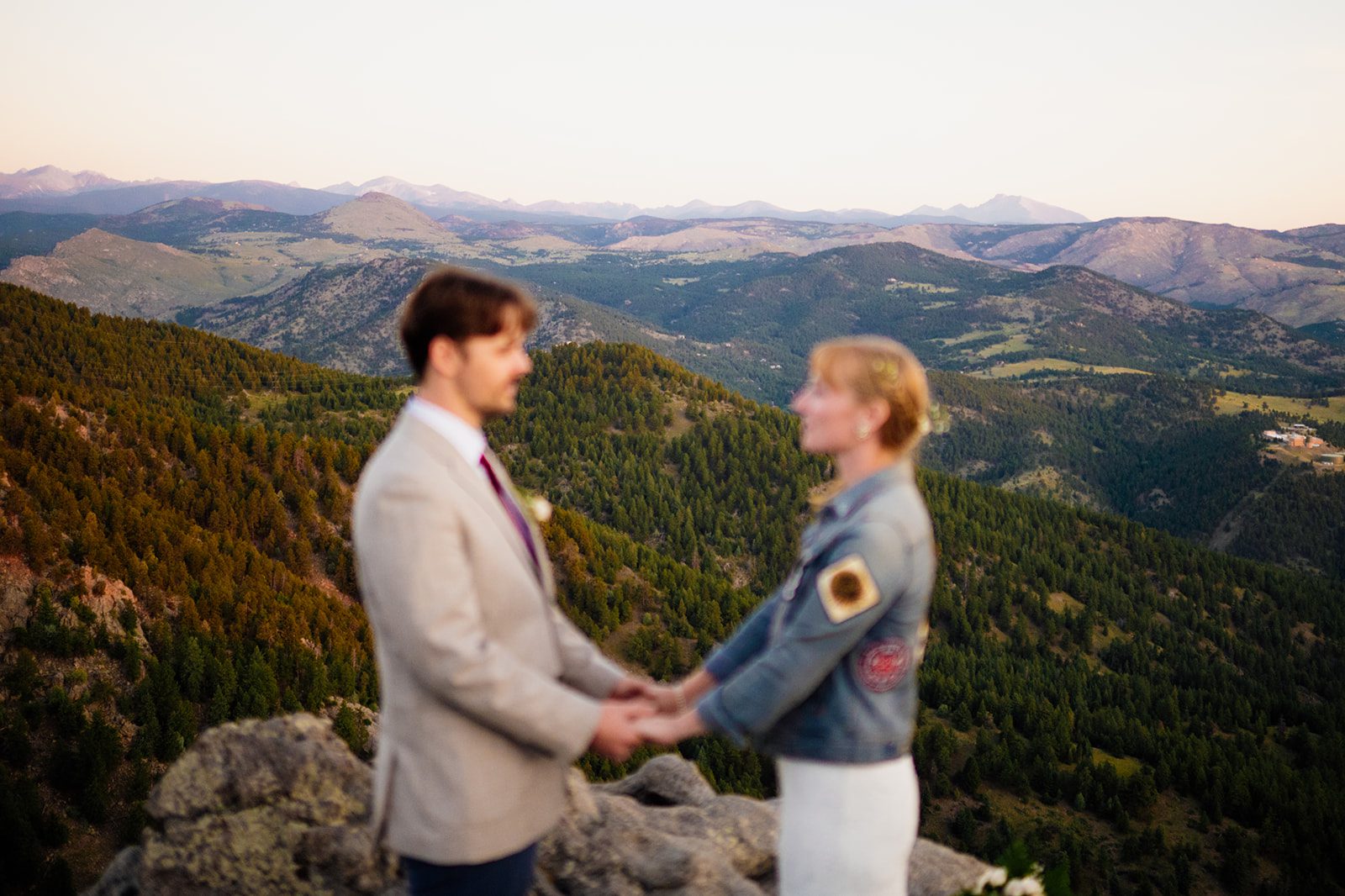 views of the Boulder during sunrise elopement ceremony at Lost Gulch Overlook