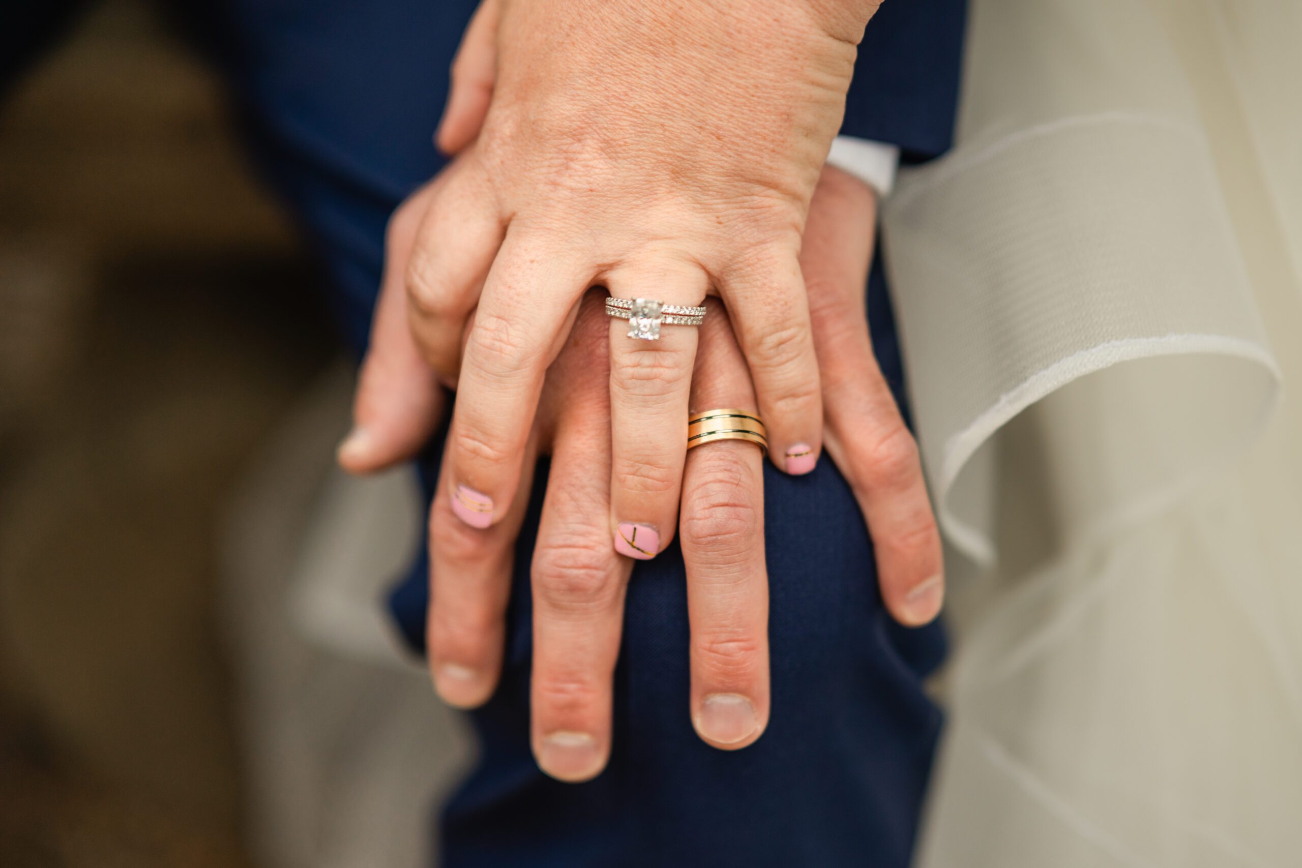 the bride and grooms hands with their rings at their Bear Lake elopement. 