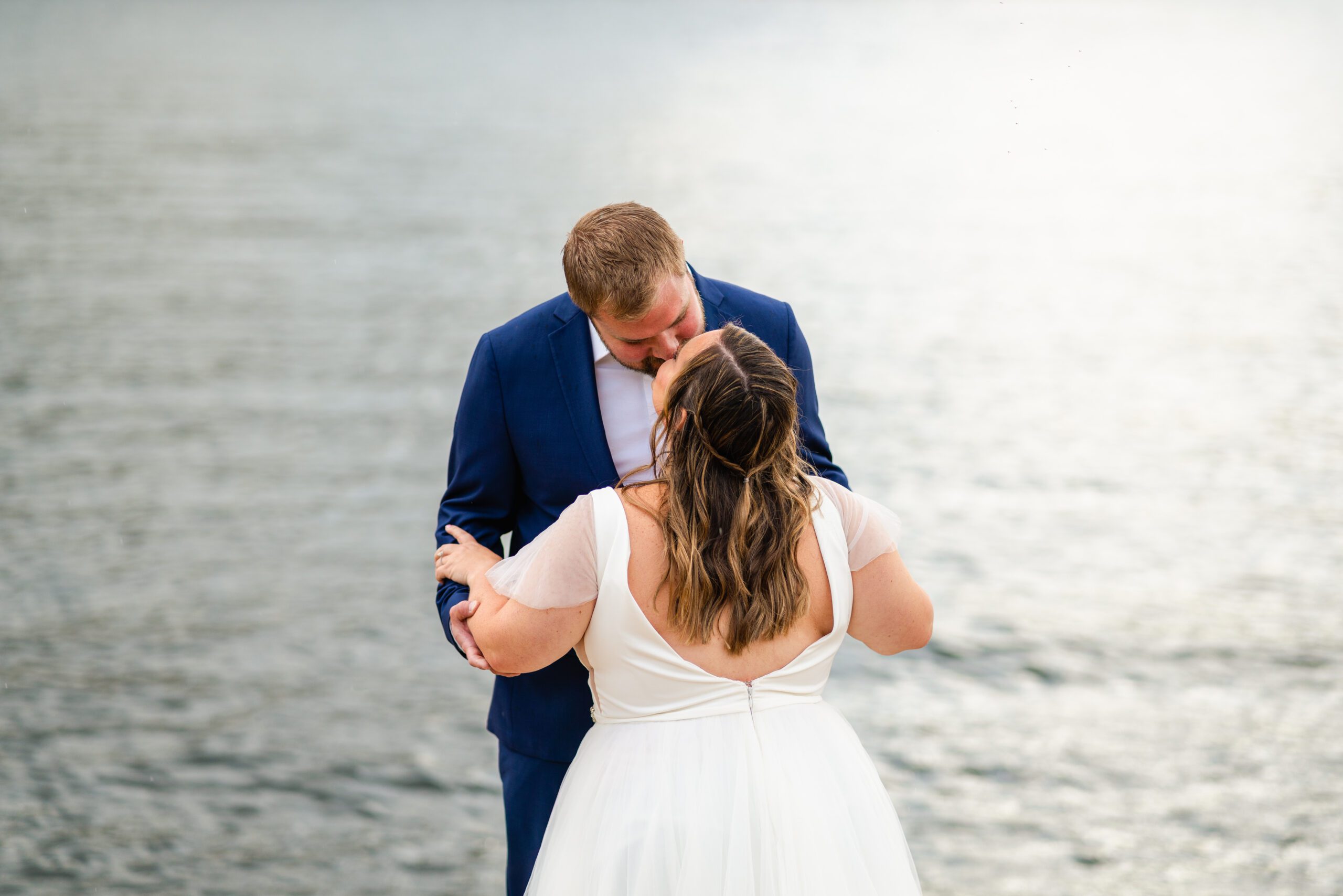 bride and groom kiss during their  Bear Lake elopement after their first look. 
