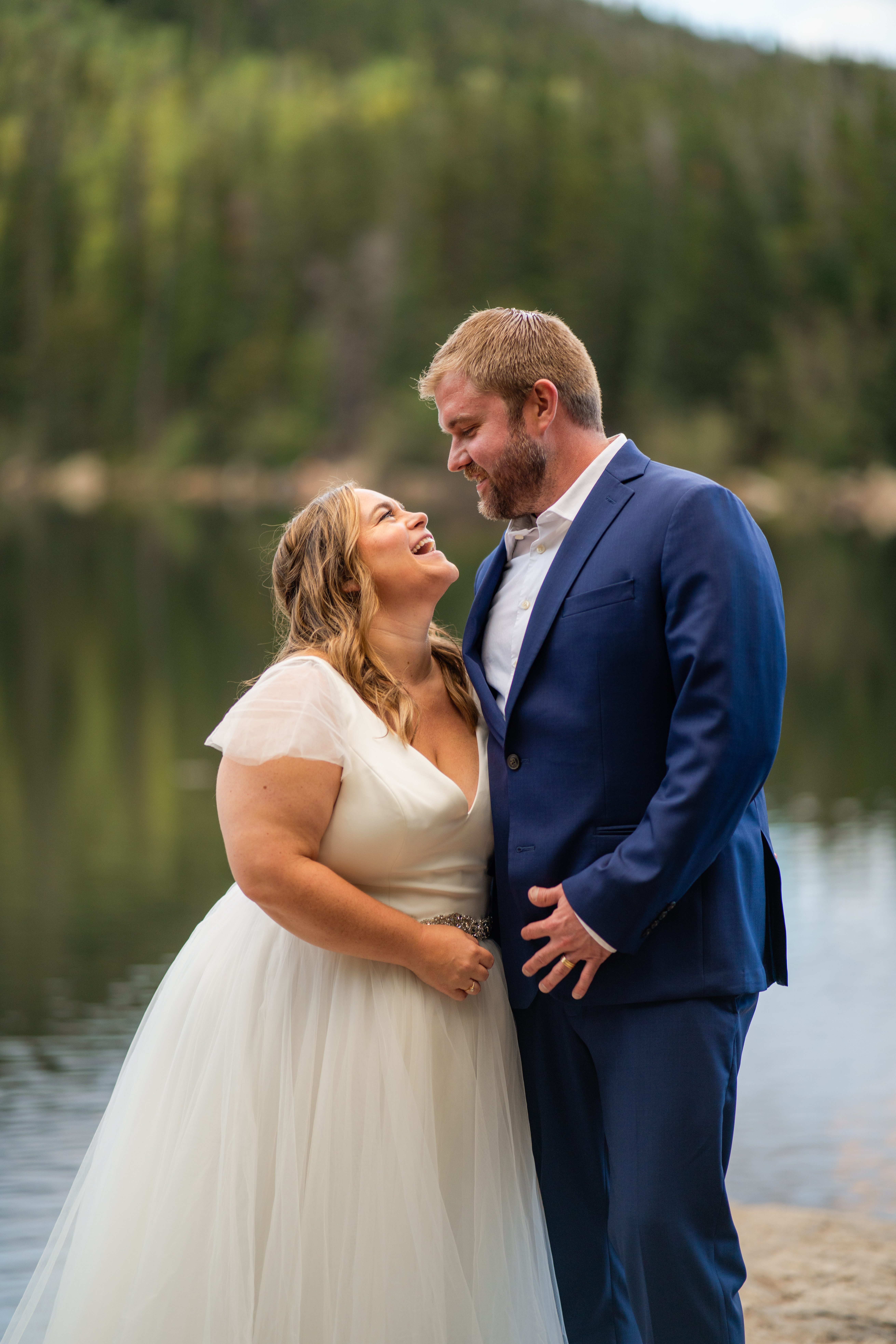 the bride and groom looking at each other, smiling sweetly at their Bear Lake elopement. 