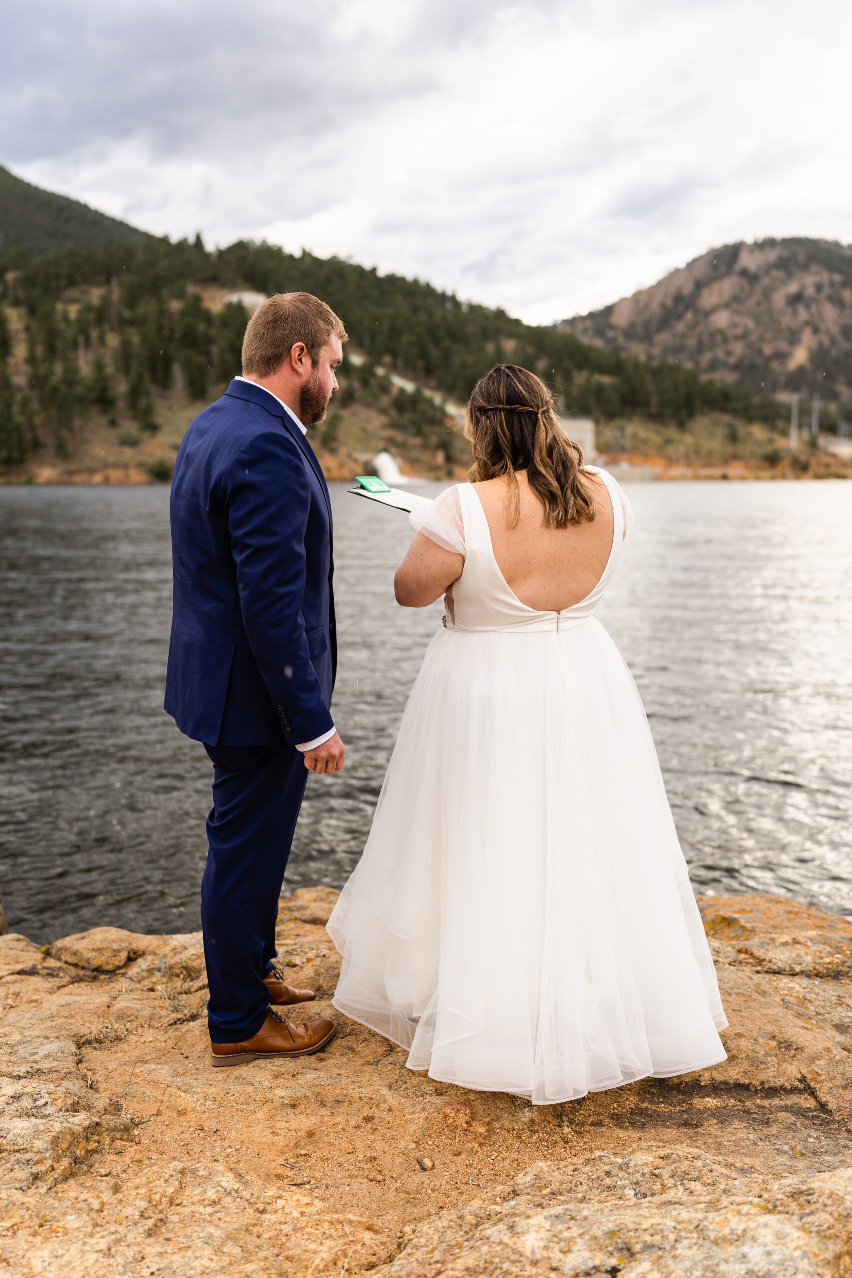 bride signs the marriage license at their  Bear Lake elopement. 
