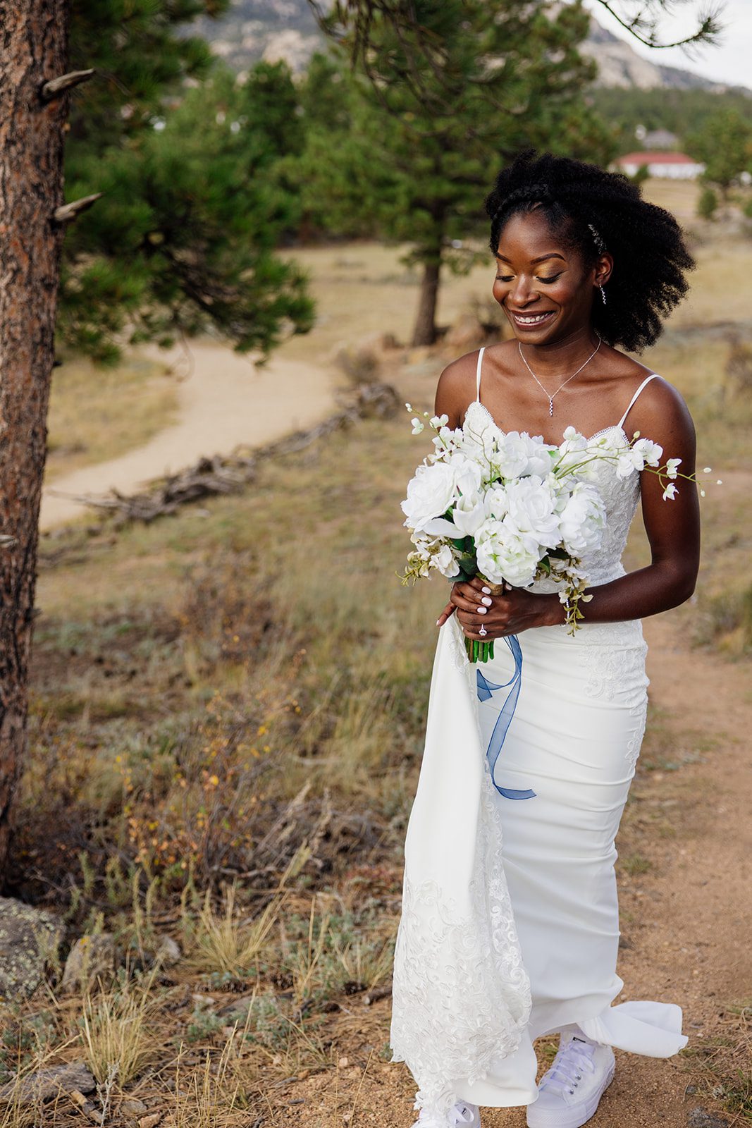 bride smiling walking towards her groom for their first look at their Knoll Willows Elopement.