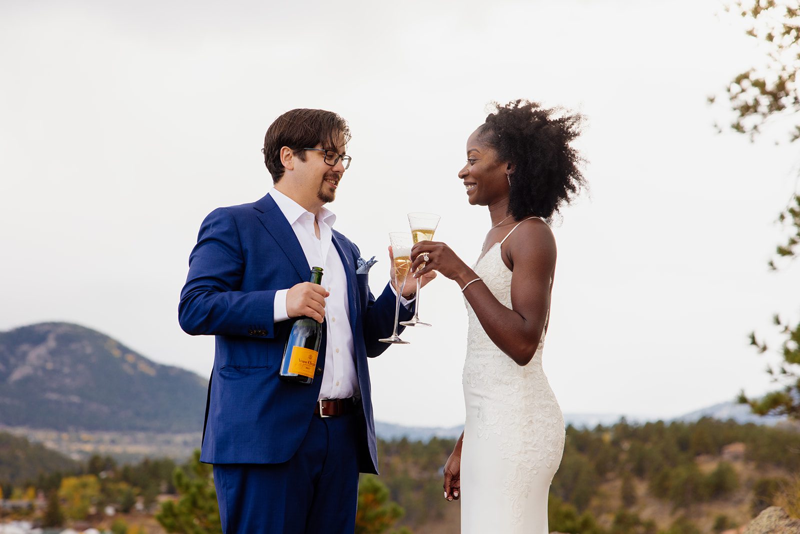 bride and groom toast with champagne flutes after Knoll Willows Elopement.