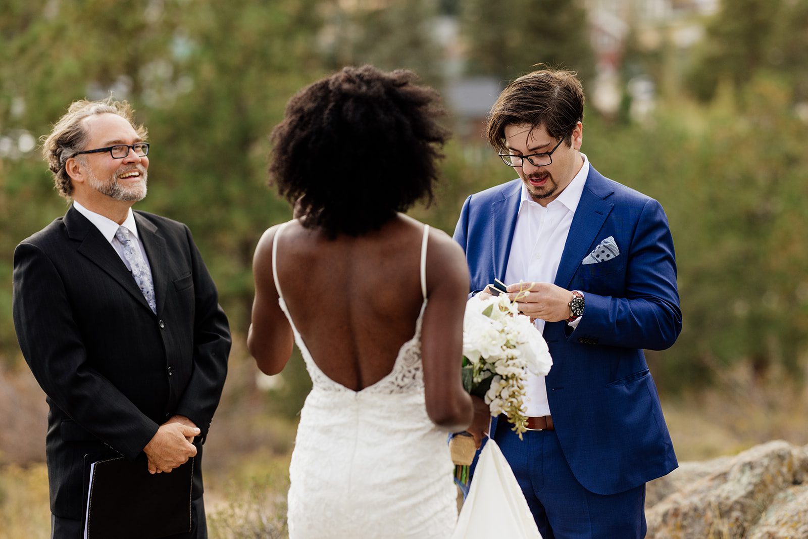 groom pulls vow book during their Knoll Willows Elopement.