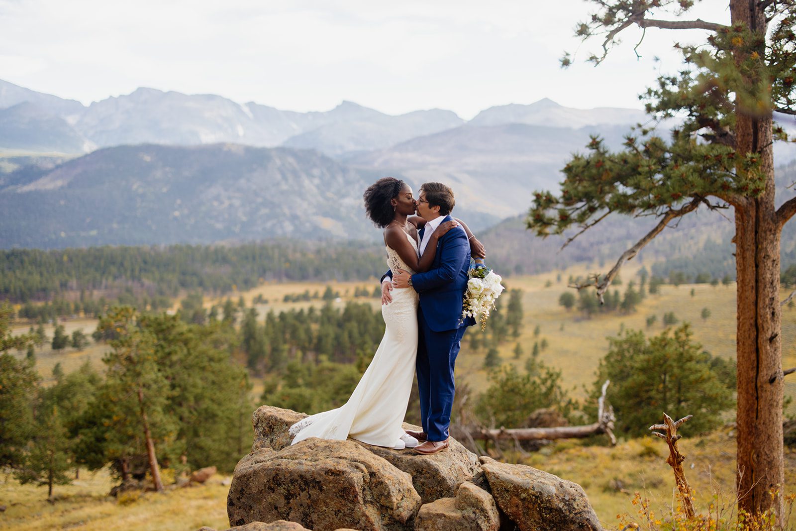 bride and groom elopement portraits in rocky mountain national park at sunset. 