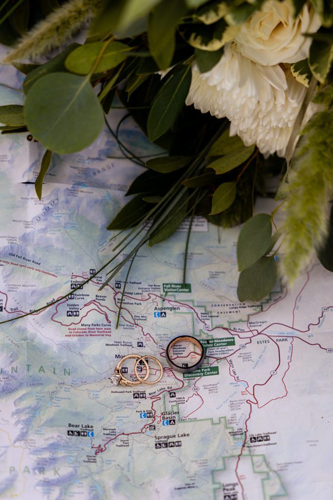 wedding rings on a map of of their elopement location 