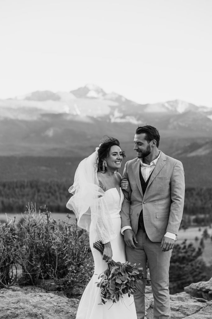 the bride and groom are lost in the moment with each other, a classic black and white photo 