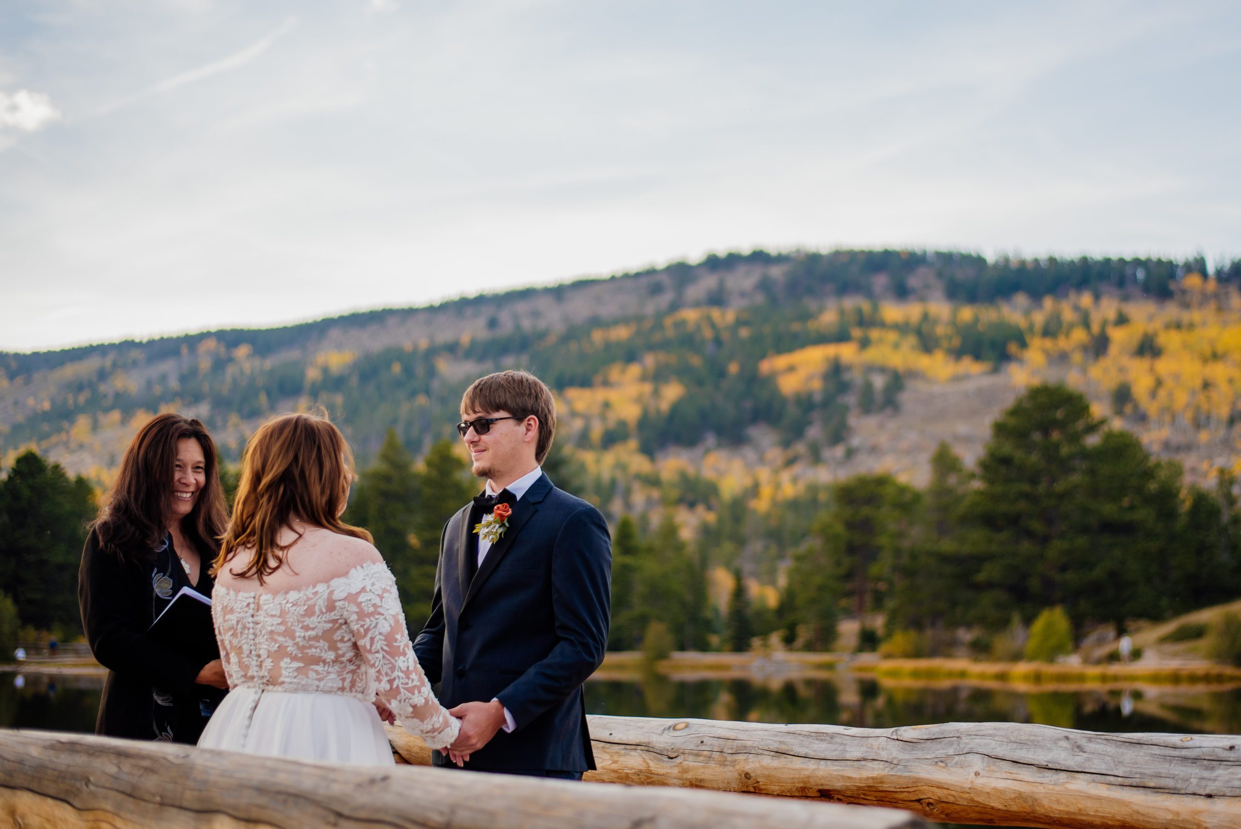 Bride and Groom during ceremony on the Lake at Sprague Lake - RMNP