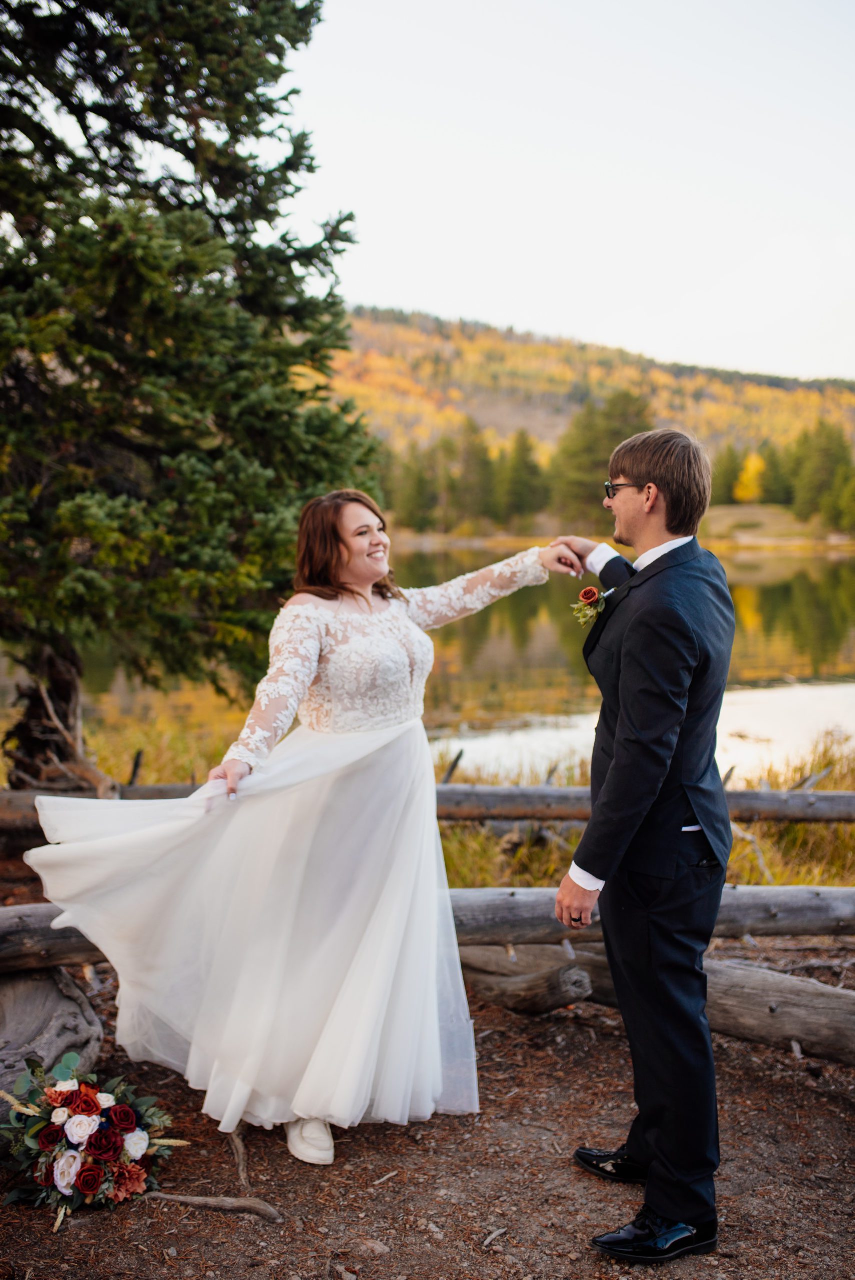 Bride and groom dancing together at Sprague Lake - RMNP