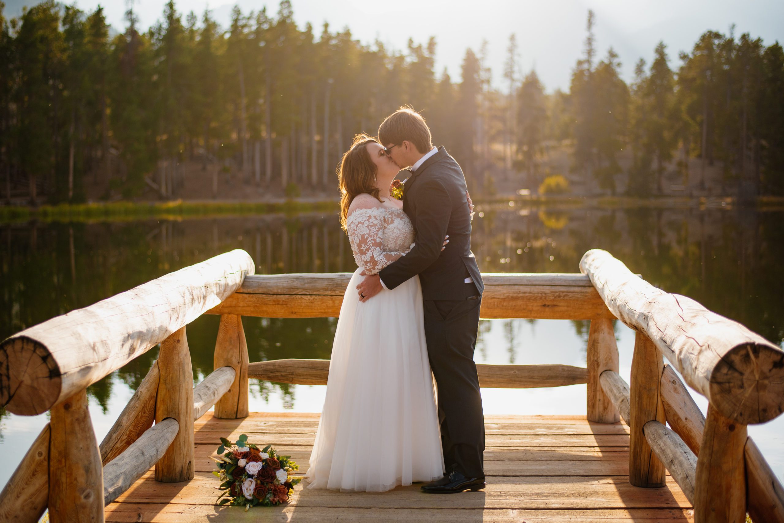Their first kiss as husband and wife! at Sprague Lake - RMNP