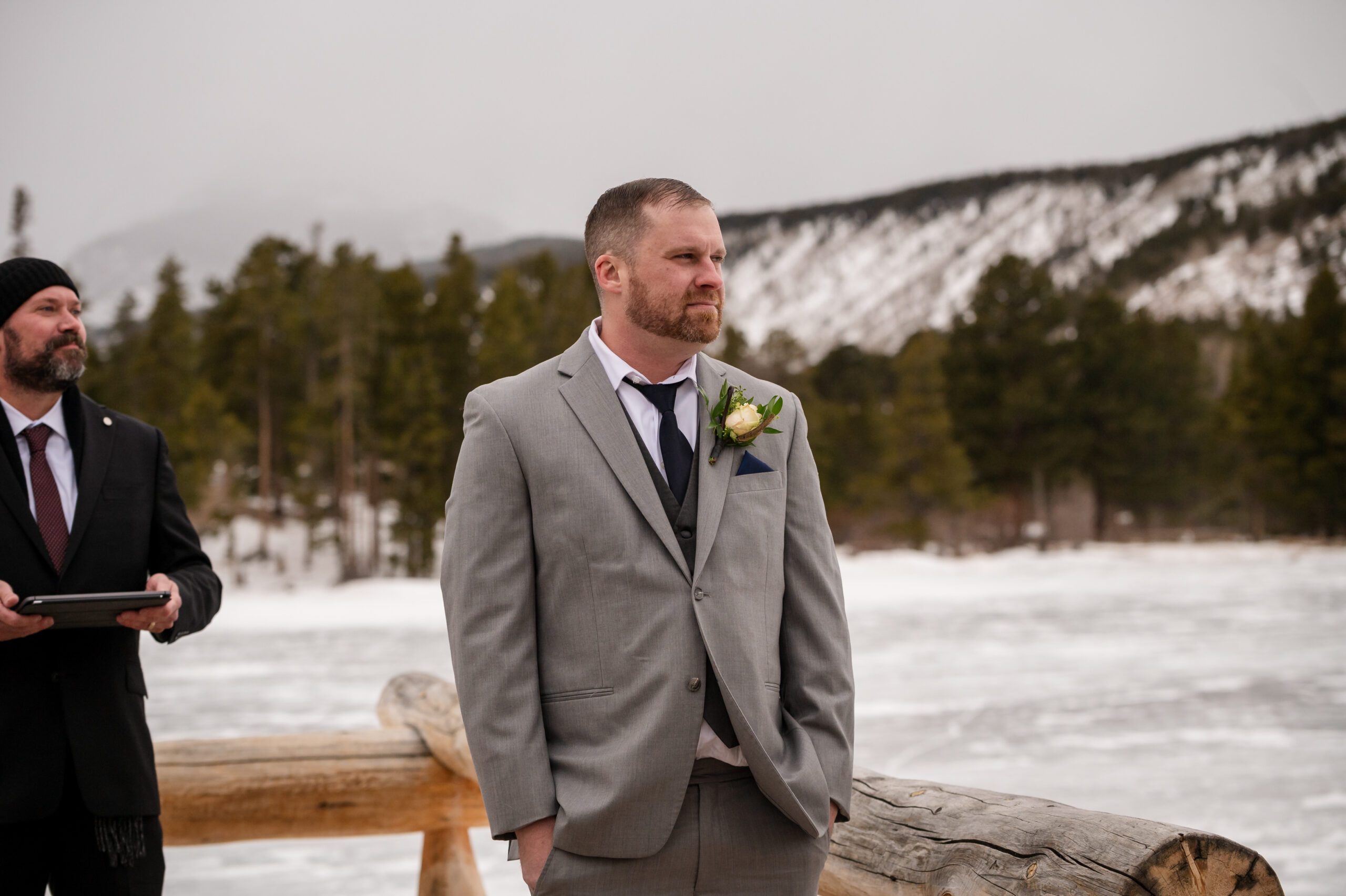 Groom waiting patiently for his bride at his Winter Elopement at Sprague Lake. 