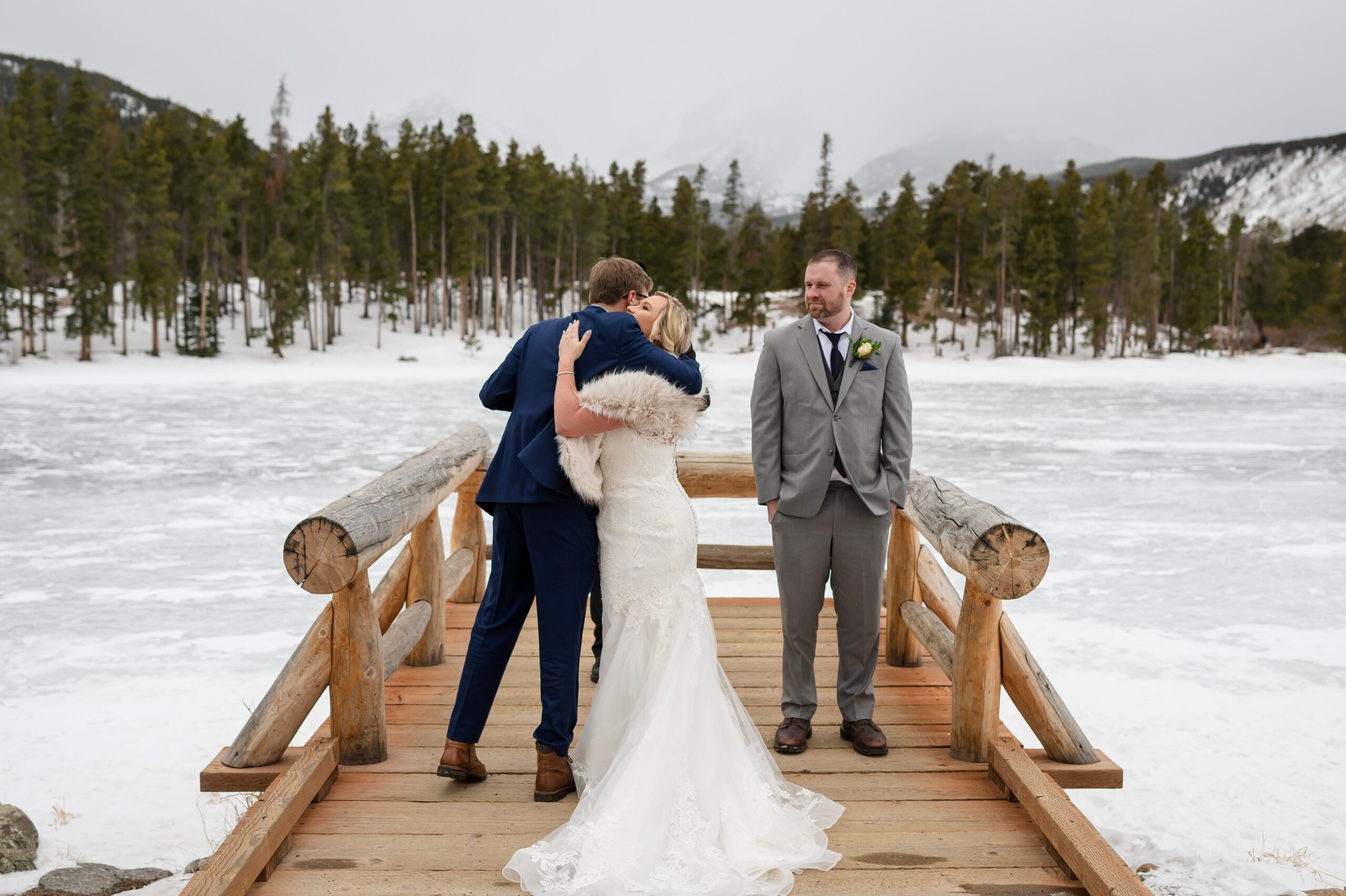 bride hugging her son before her ceremony at her Winter Elopement at Sprague Lake. 