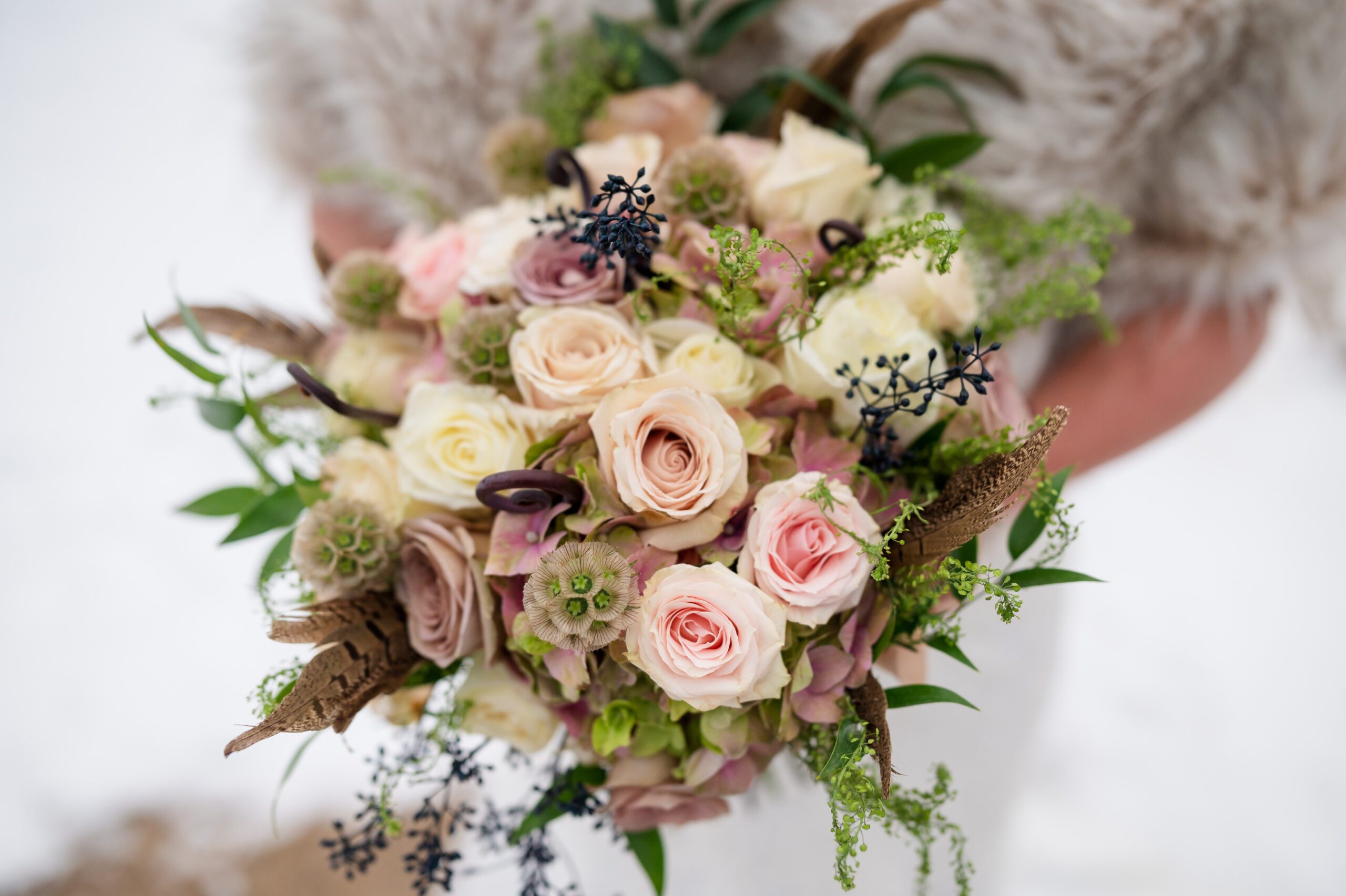 The bride's bouquet during from their Winter Elopement at Sprague Lake. 