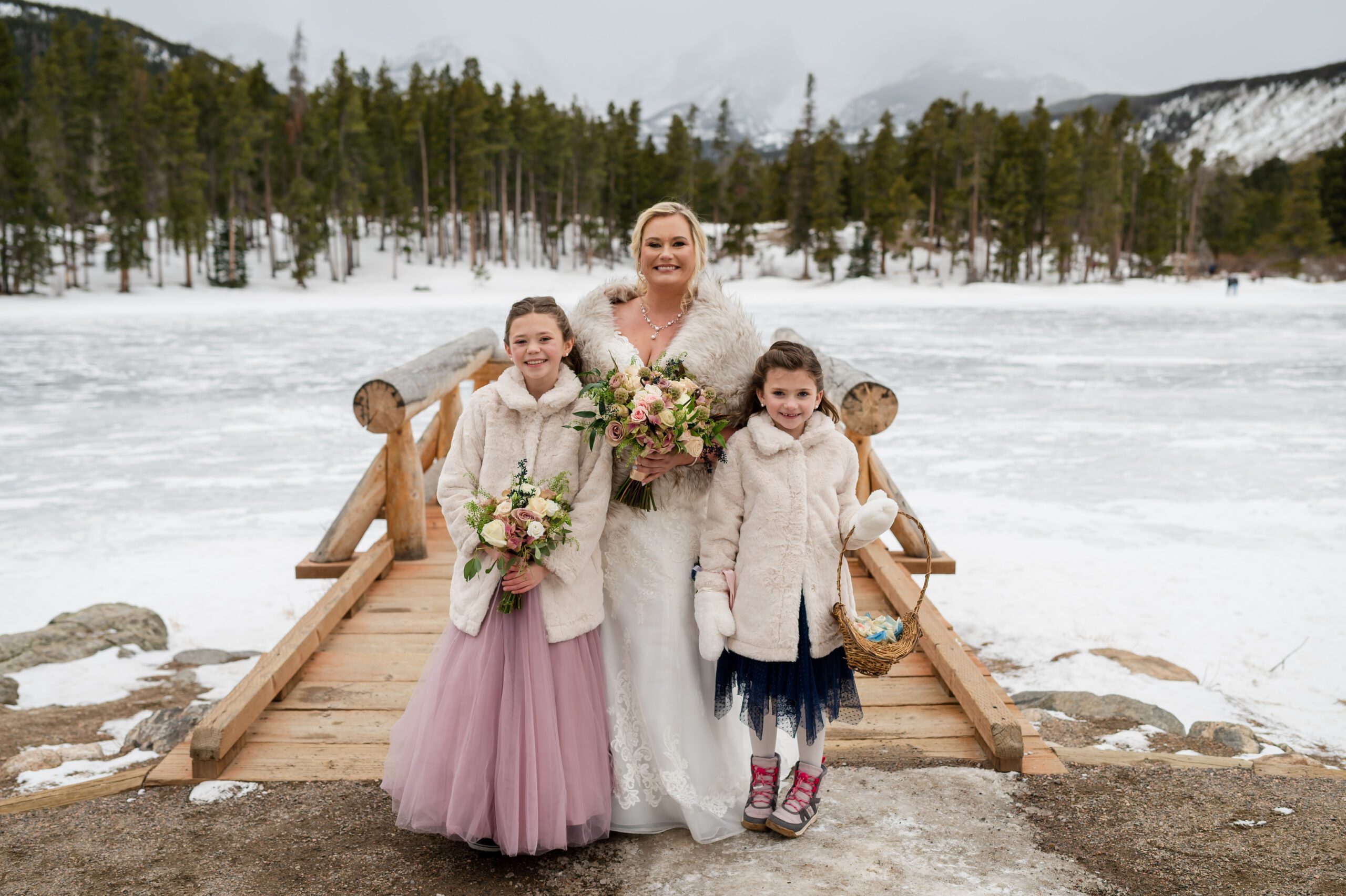 a shot of the bride with her two girls during her Winter Elopement at Sprague Lake. 