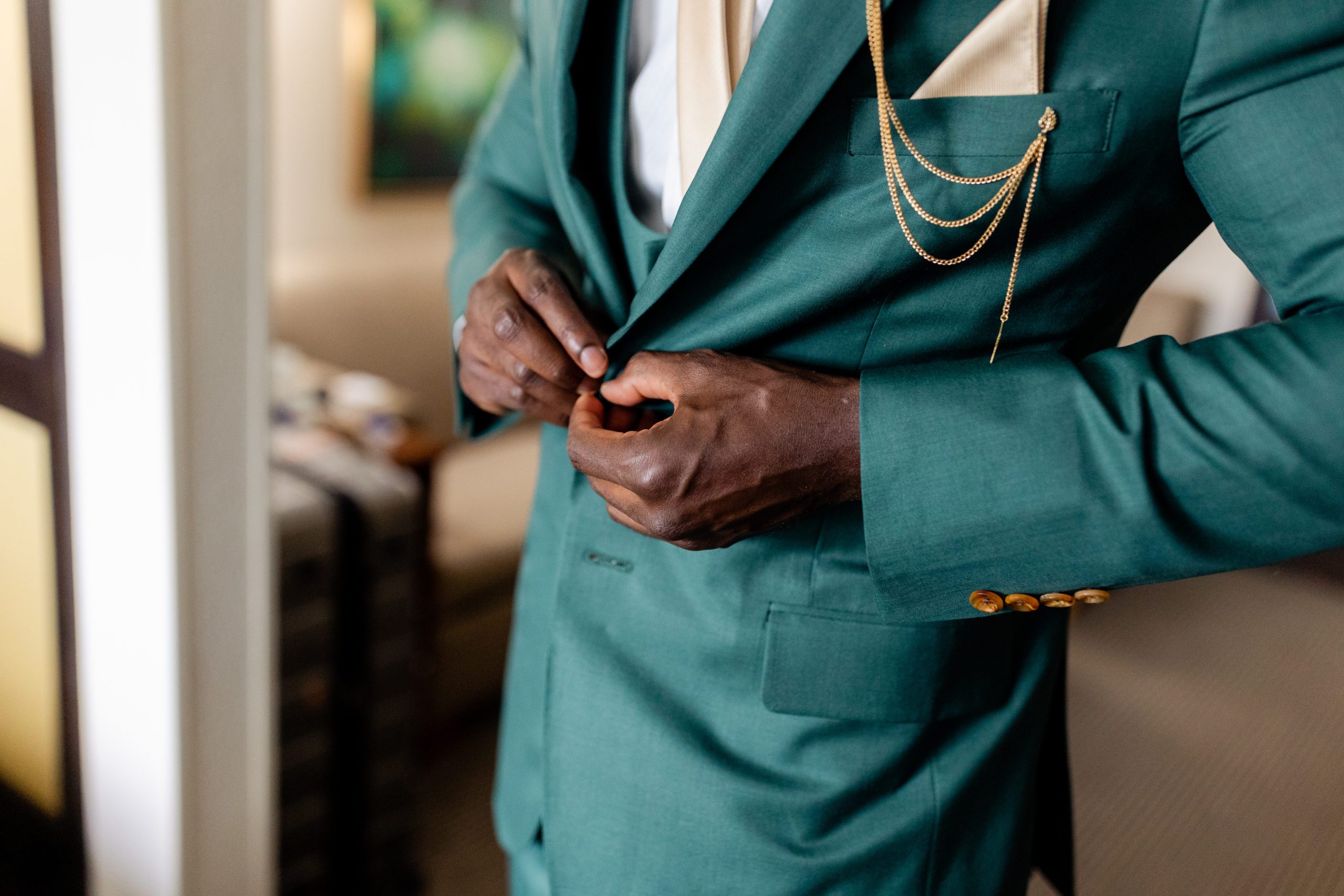 Detail shot of the groom getting ready for their elopement ceremony at the Garden of the Gods