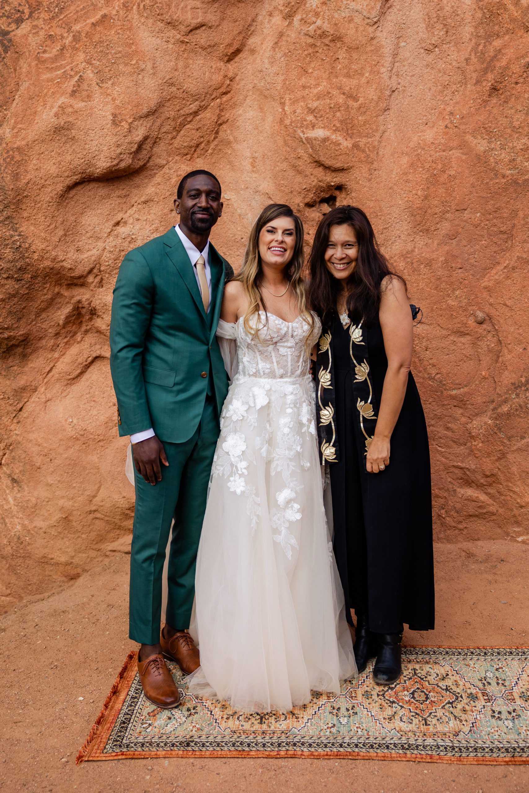 Bride and groom with their officiant Lisa at their elopement at the Garden of the Gods