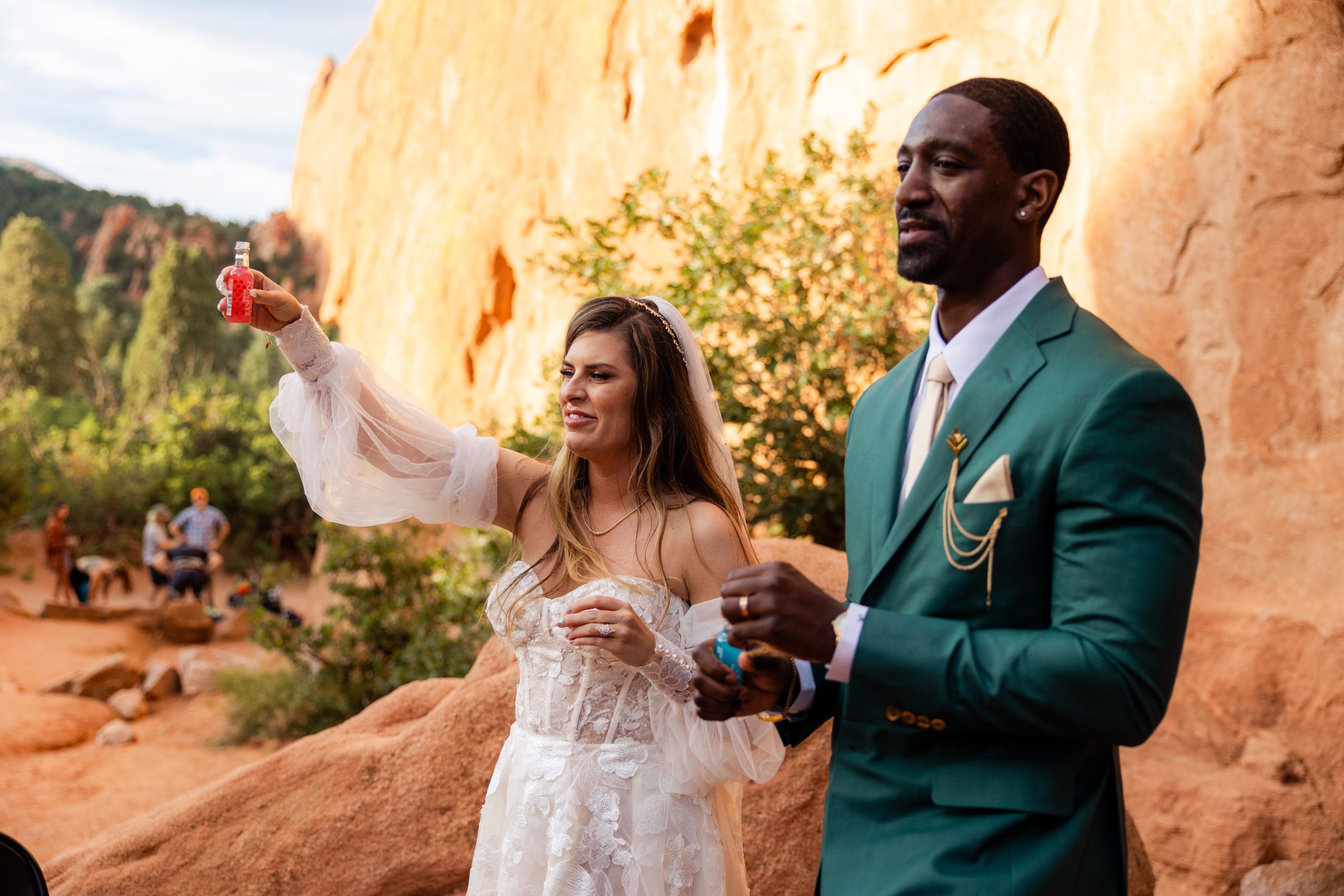 Bride and groom toast with shots after their elopement ceremony at the Garden of the Gods. 