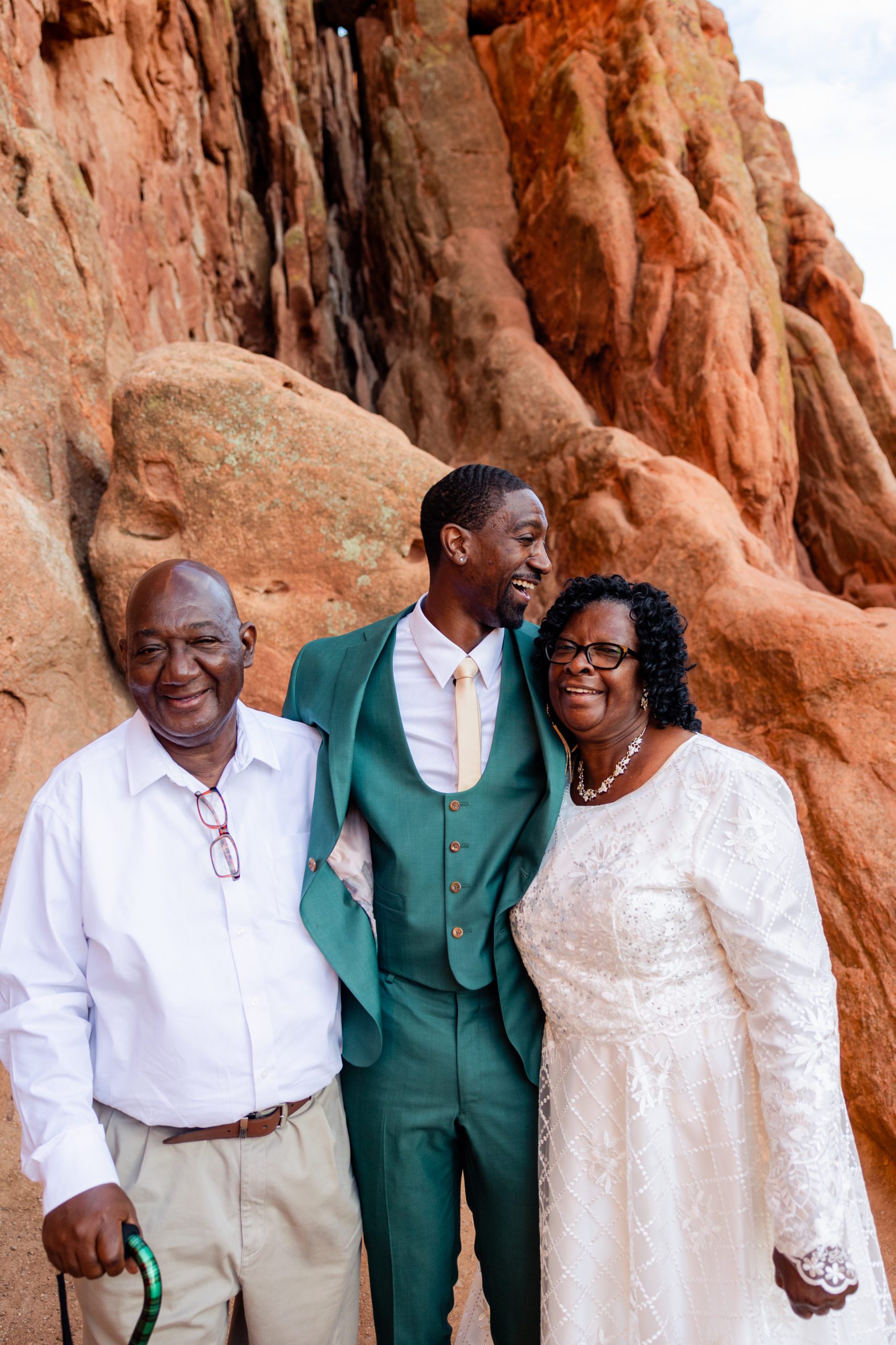 Groom with his happy parents at the Garden of the Gods. 