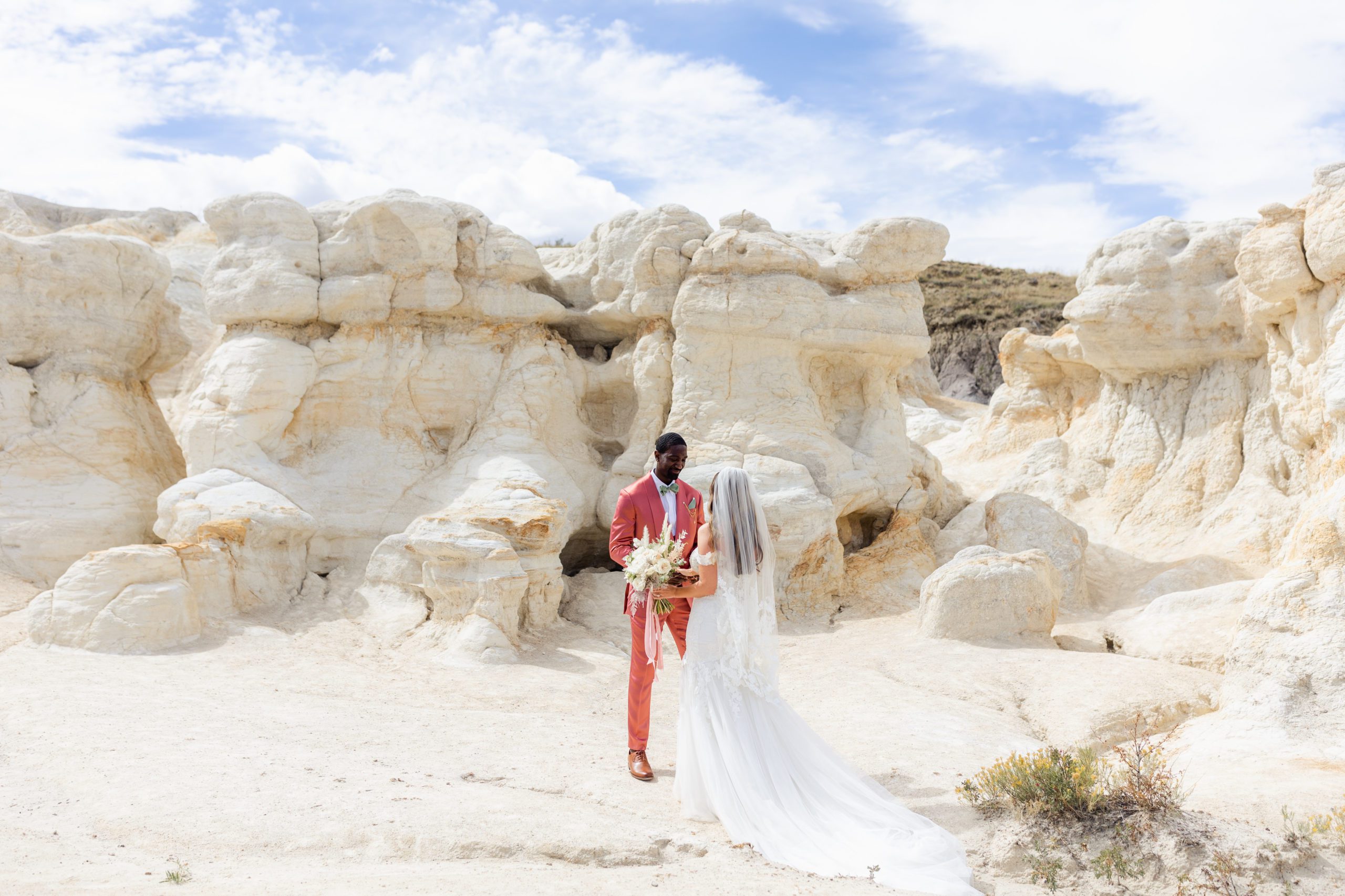 Bride and groom at the Paint Mines for their first look before their elopement at the Garden of the Gods