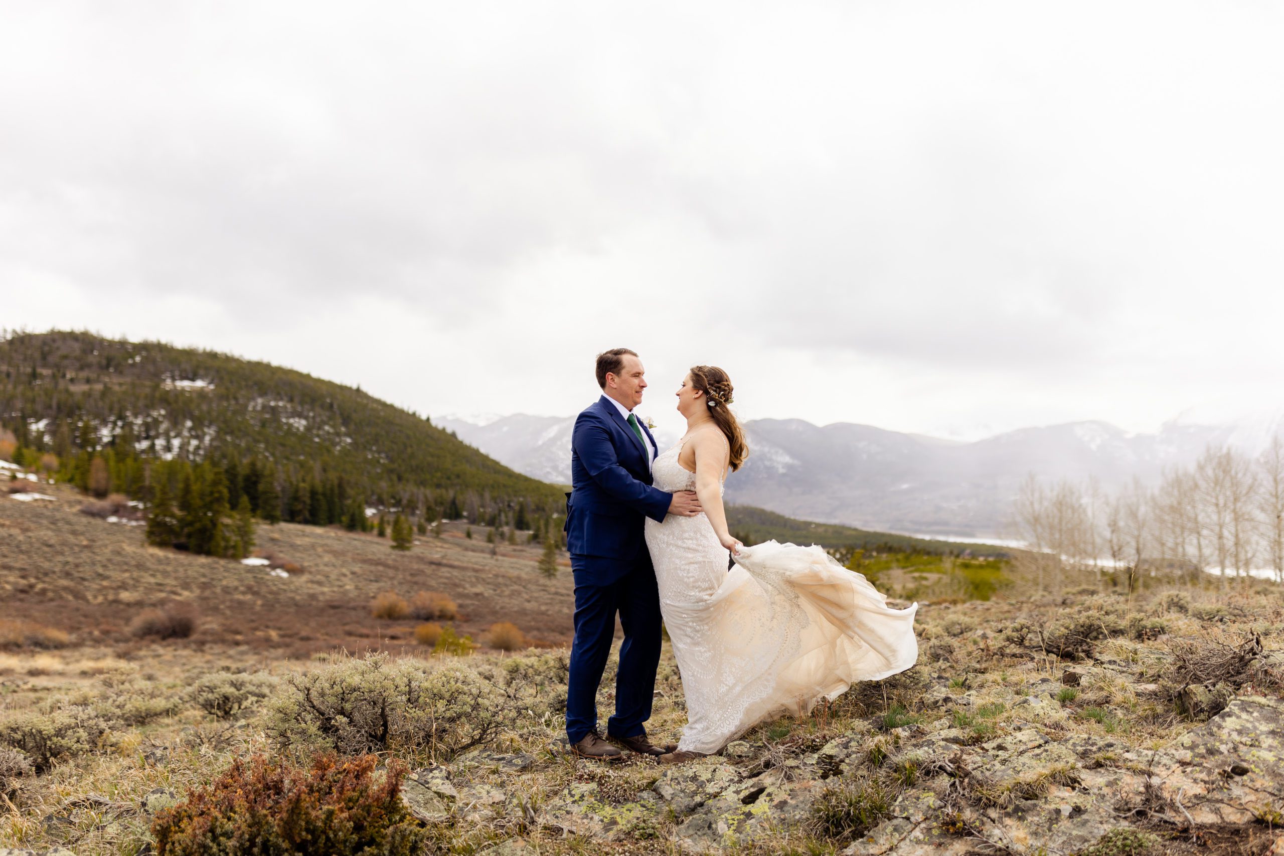 The bride and groom take their couples portraits at Loveland Pass before their Sapphire Point Elopement.
