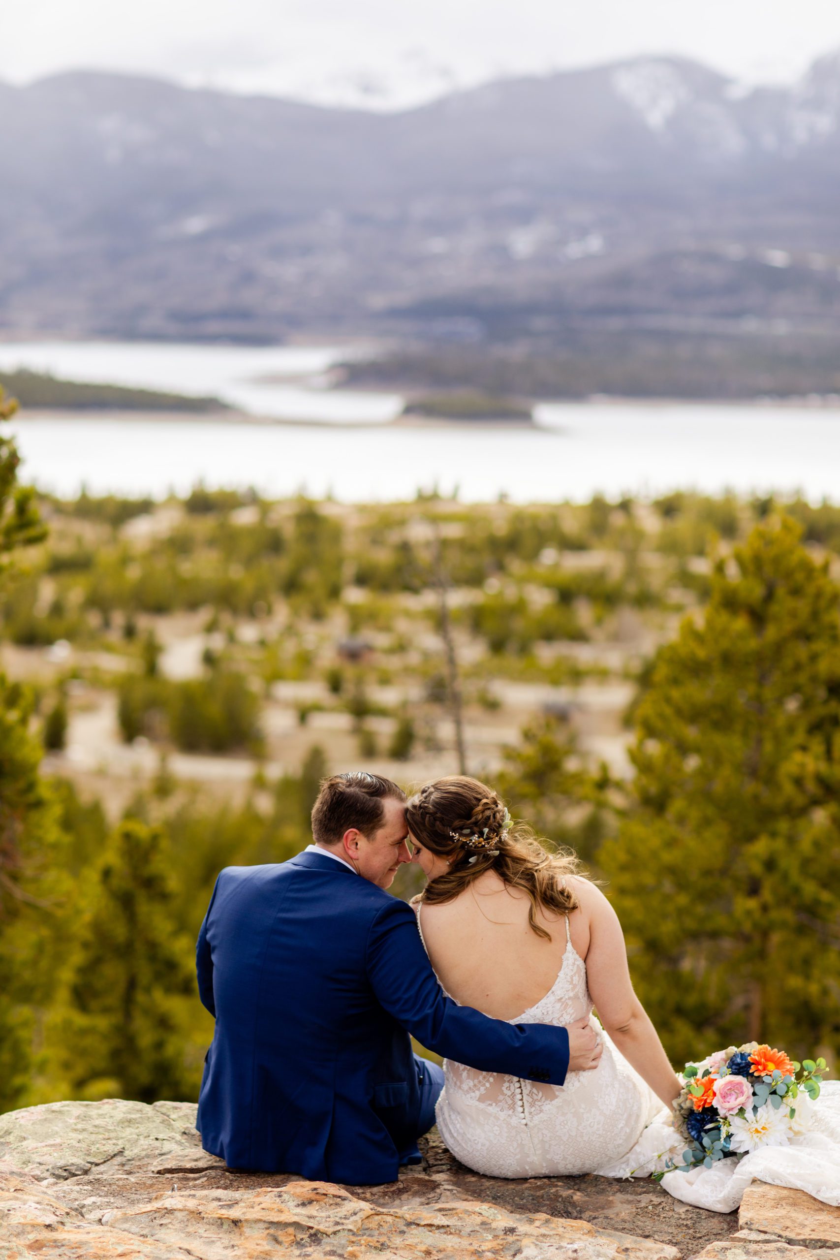 The bride and groom sitting nose to nose before their Sapphire Point Elopement ceremony. 