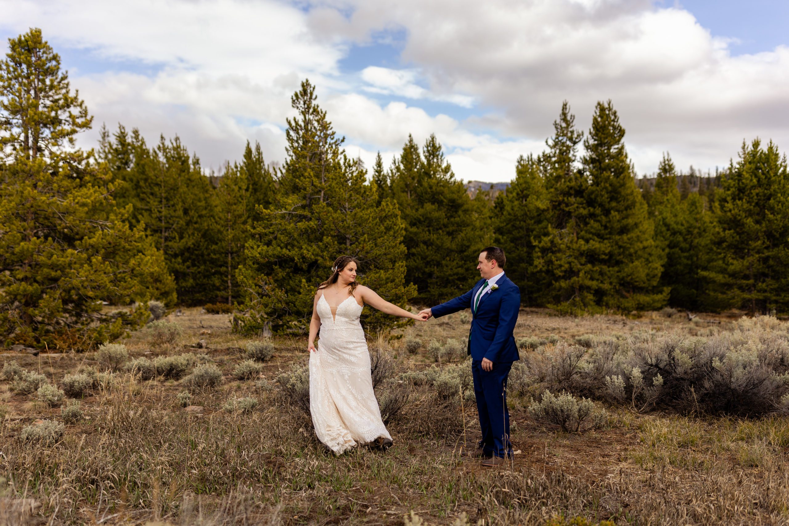 The bride and groom dances amongst the tress before their Sapphire Point Elopement.